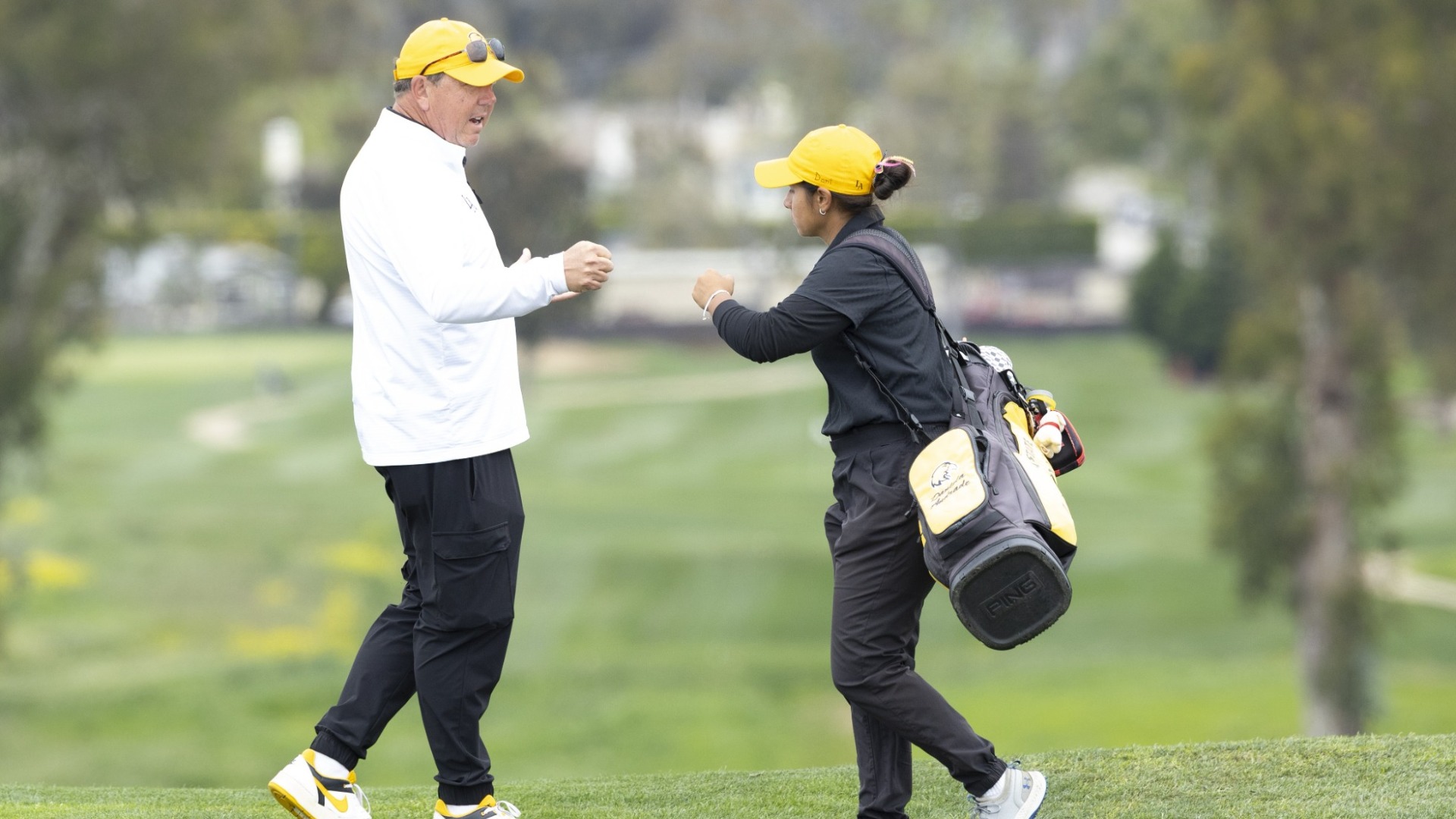 hans kersting and daniela andrade fist pump after a good shot