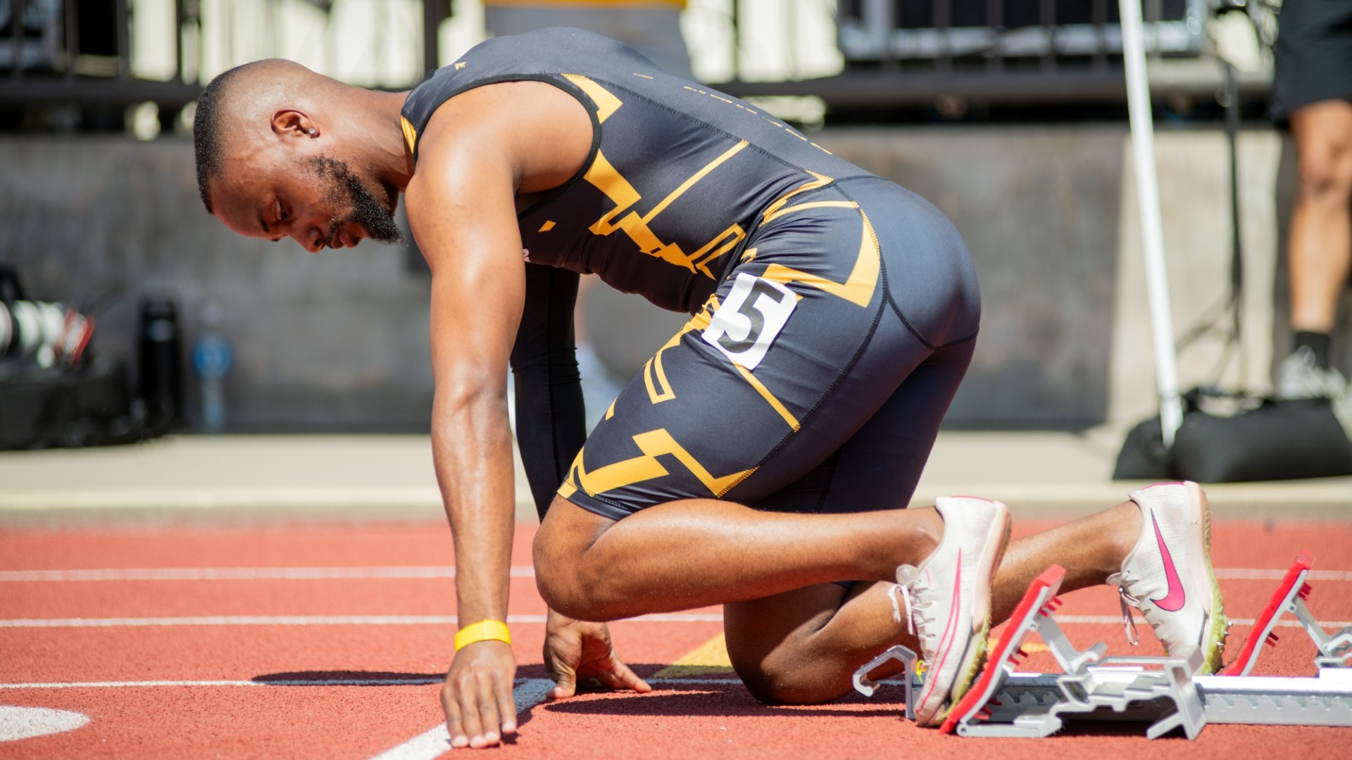 leon tafirenyika lines up in the starting block