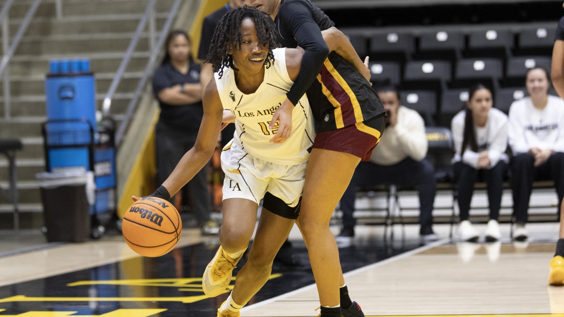 mariah blake works around a dominguez hills defender
