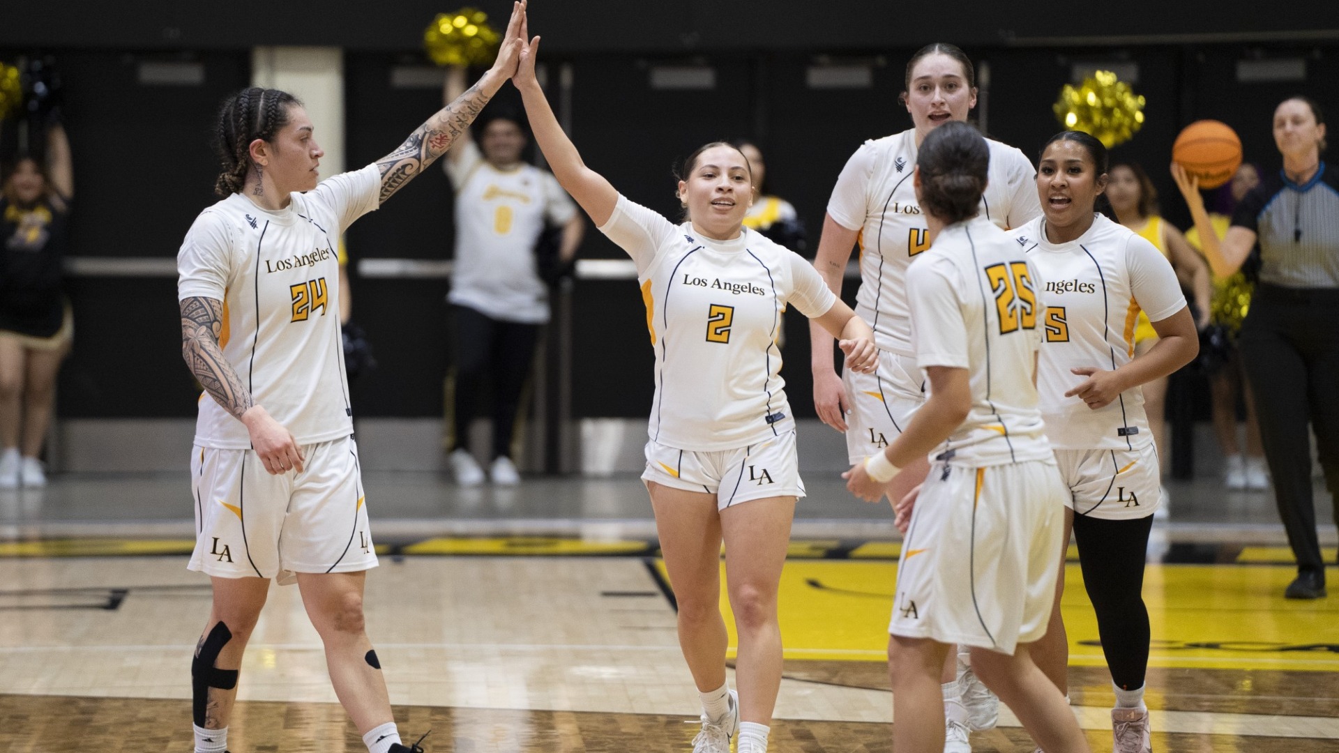 ariyah smith high fives nevaeh asiasi as golden eagles celebrate