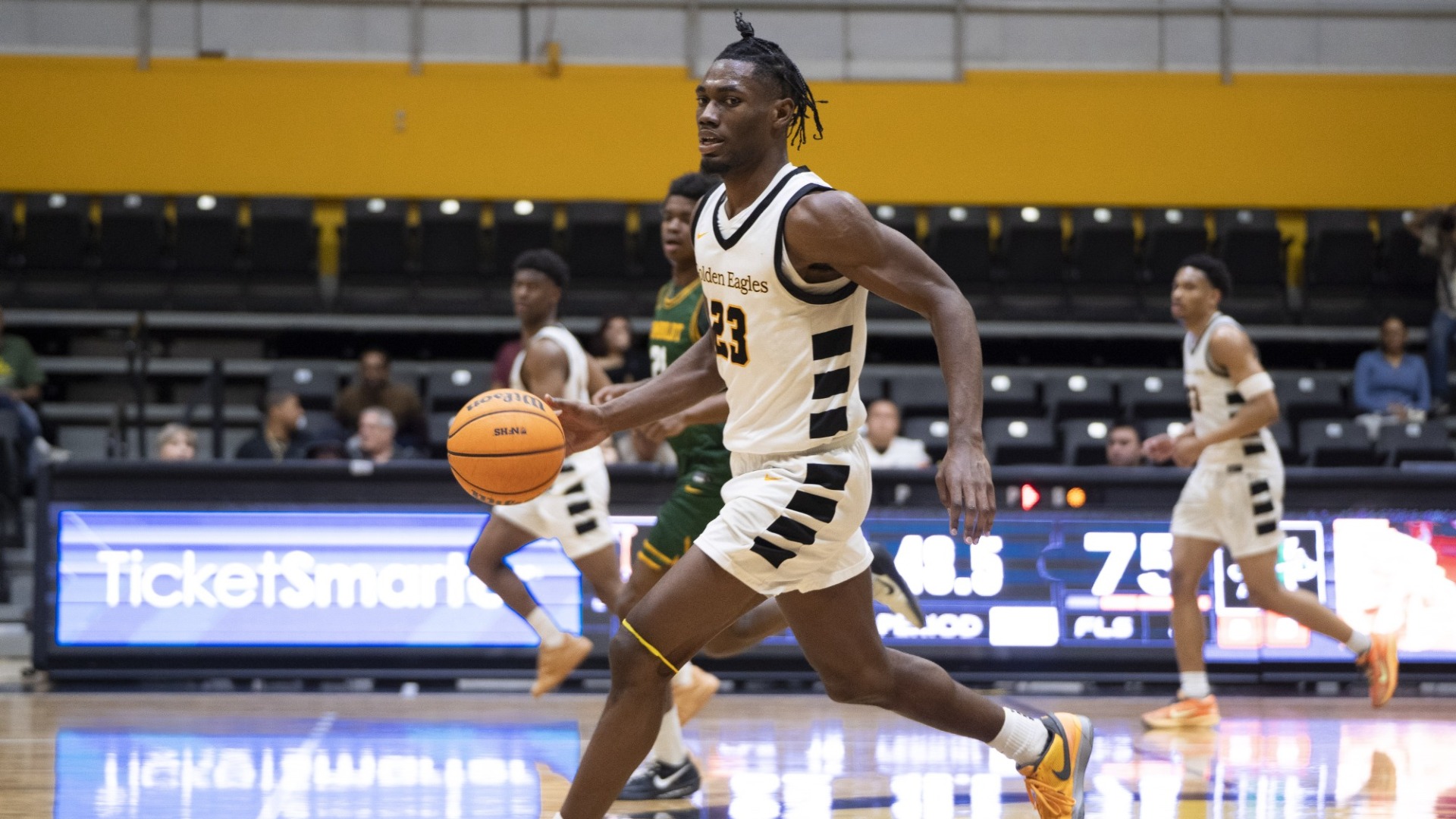 deraje agbaosi brings the ball upcourt