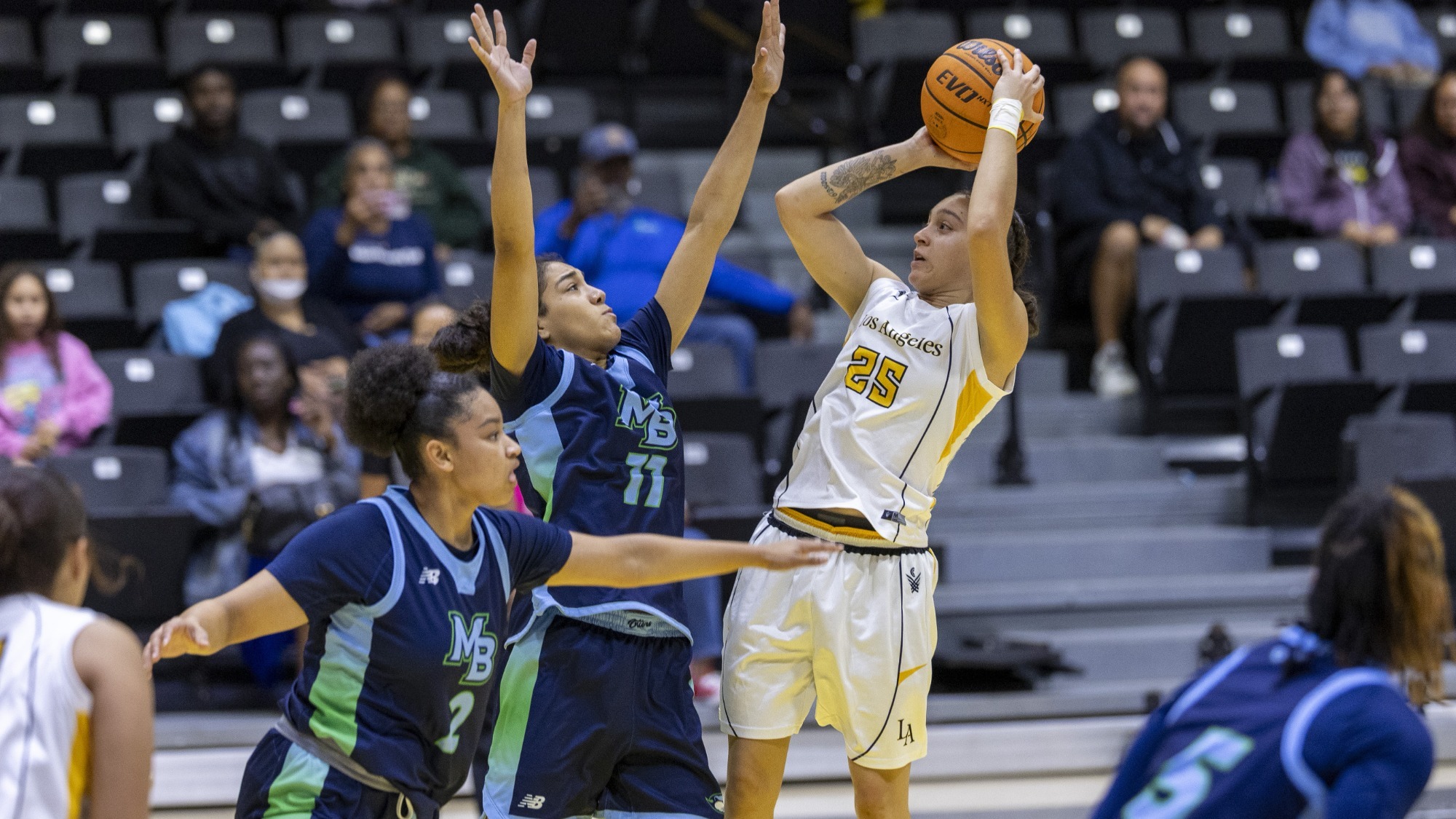 sofia fidelus shoots over some tight defense