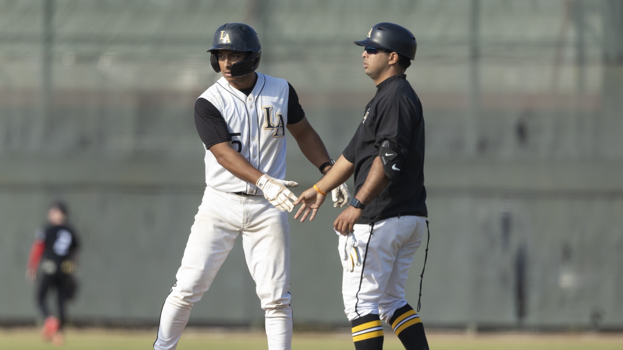 alberto prado gets congratulations after a hit