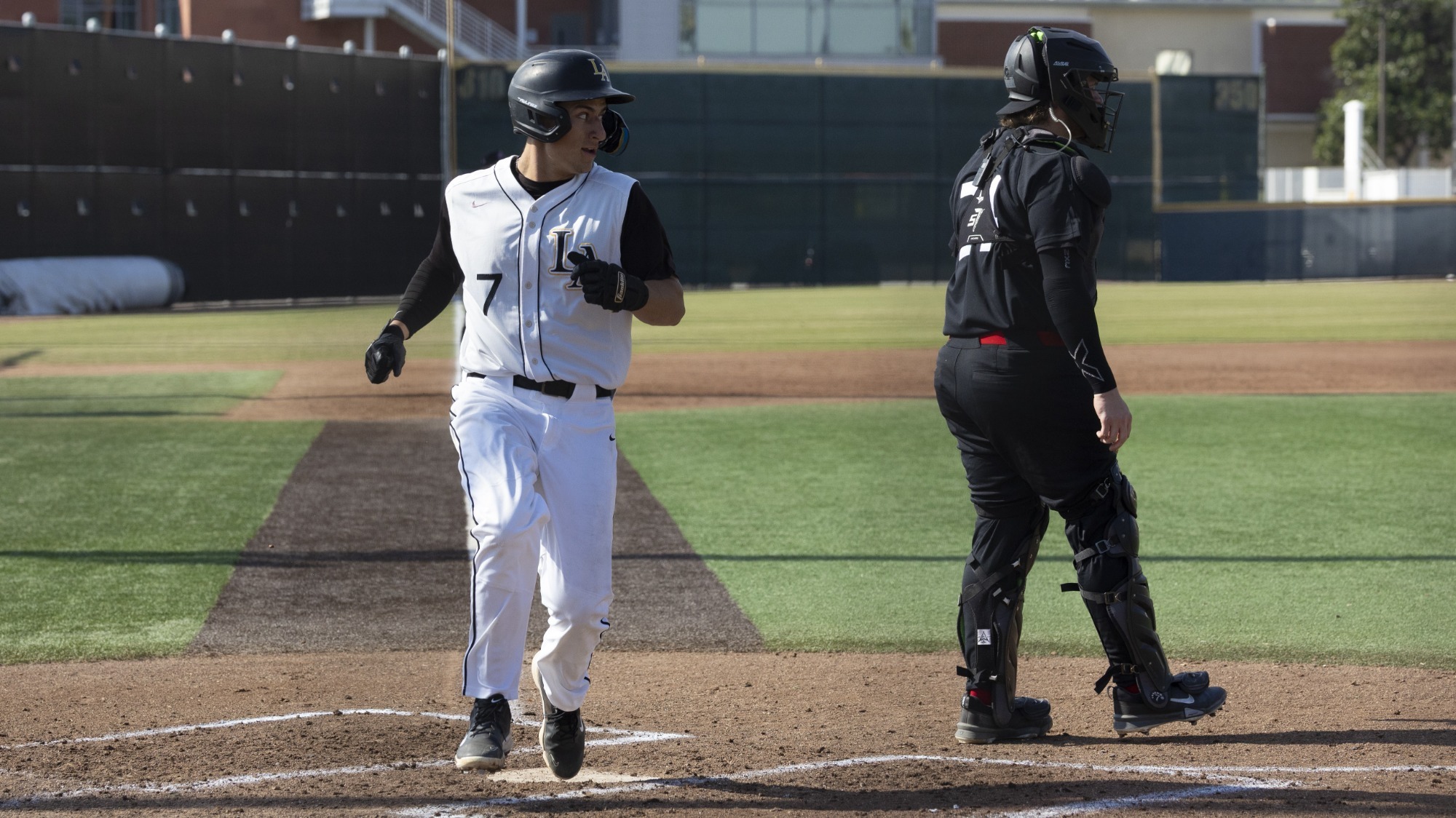 cesar chavez crosses home plate for a run