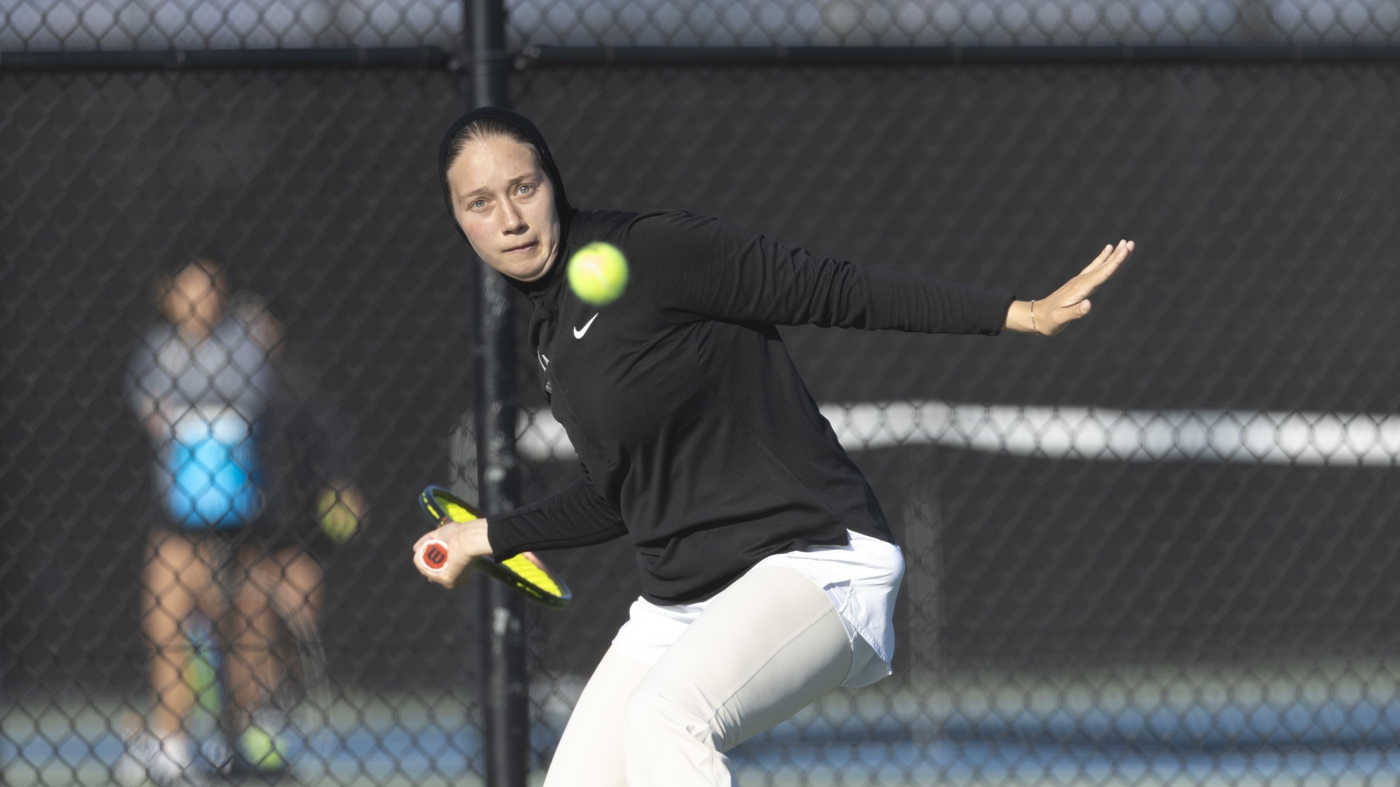 sofia pavlova hits a forehand shot from the baseline