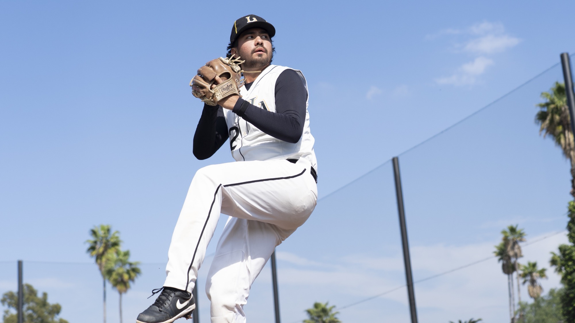 alejandro huezo gets ready to throw a pitch
