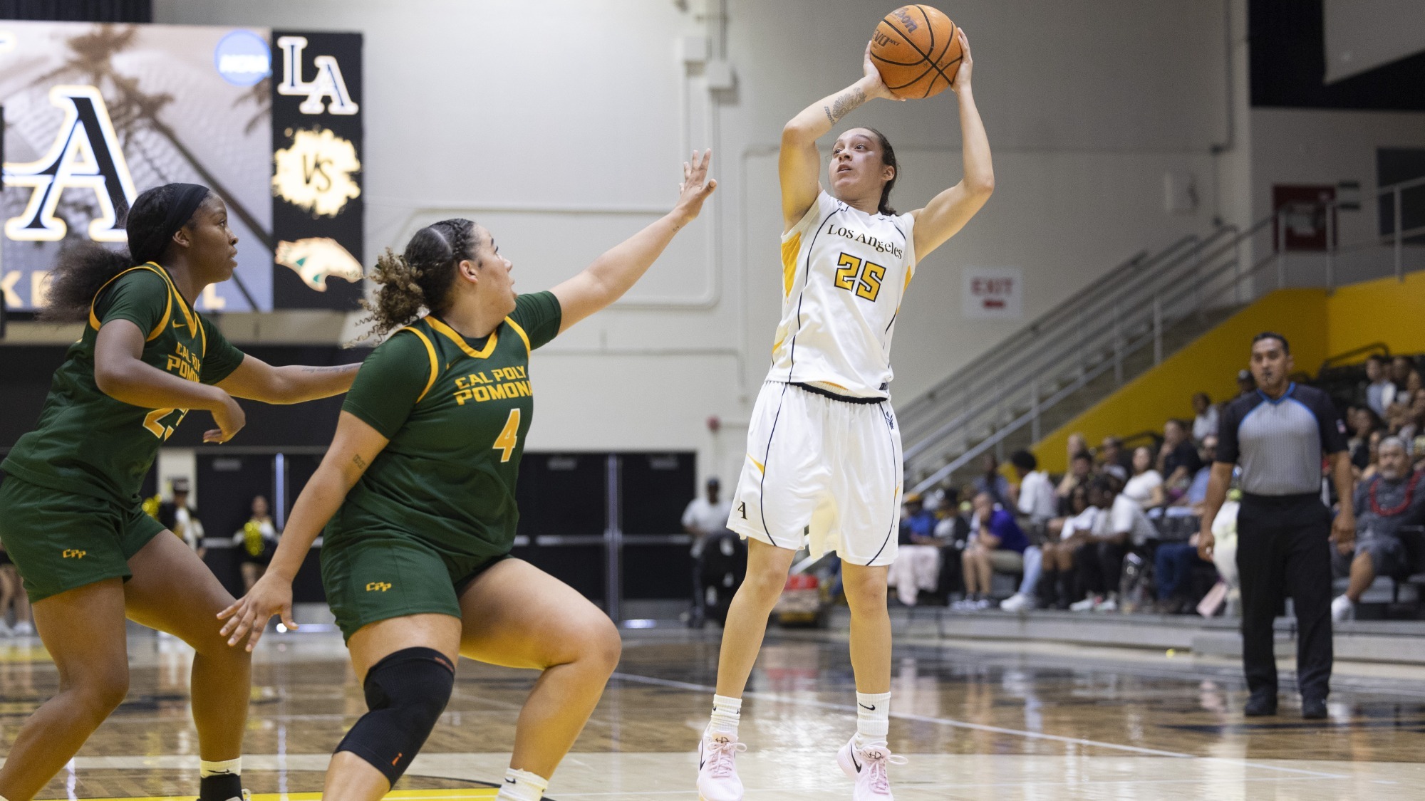 sofia fidelus takes a jumper over cal poly pomona defenders