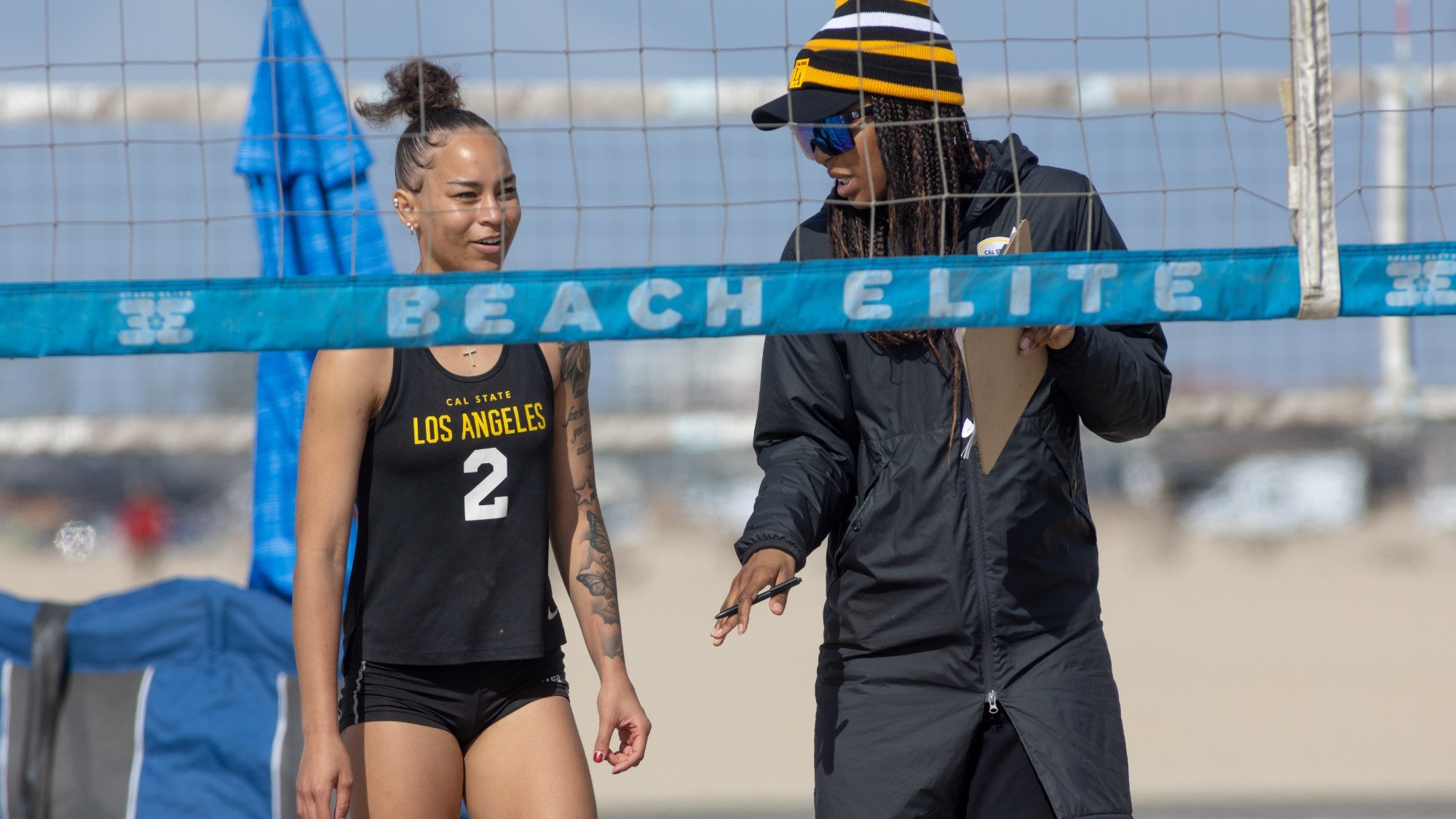 samarah dacoud talks with coach Alexis Crimes