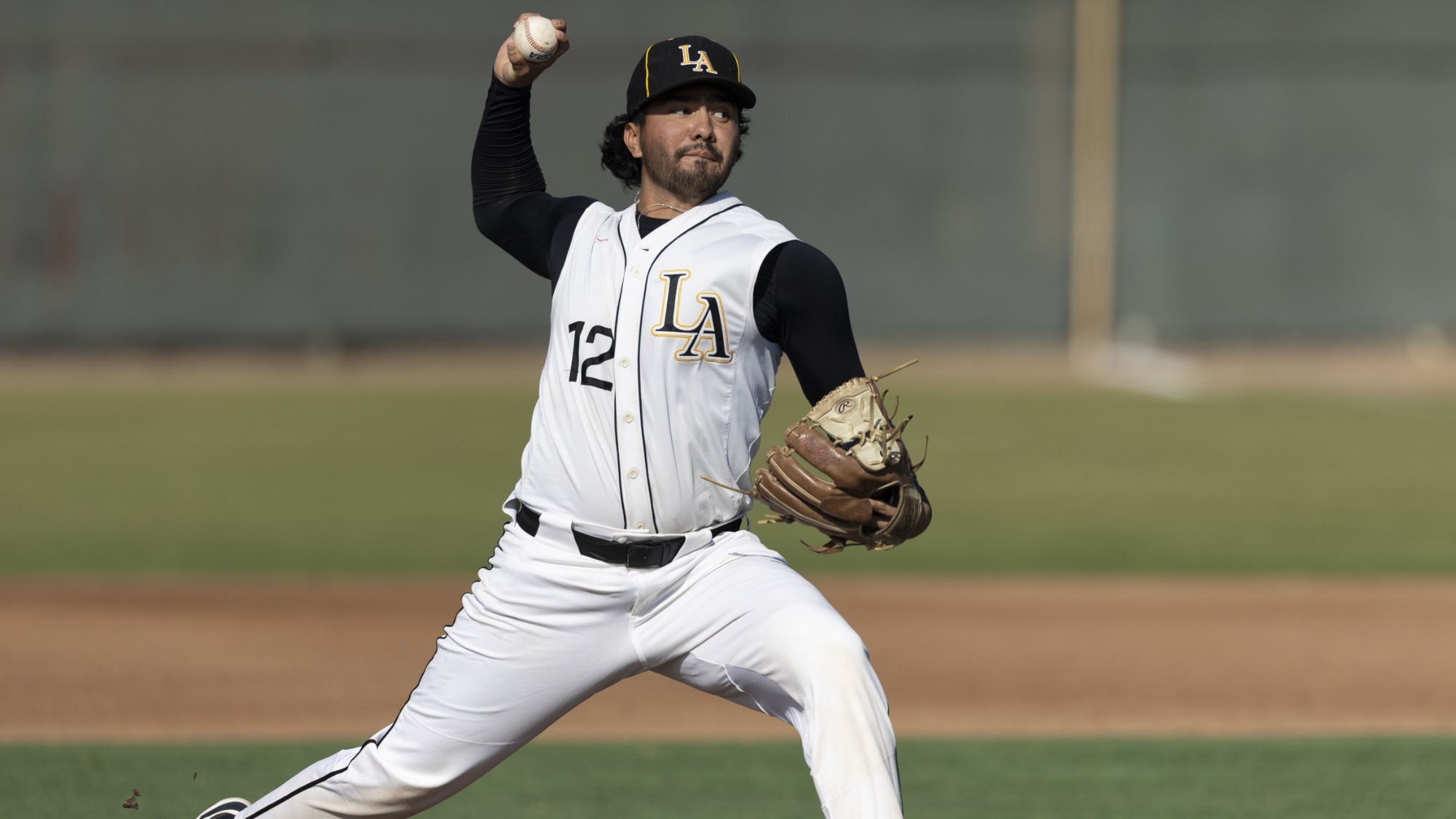 alejandro huezo fires a pitch to the plate