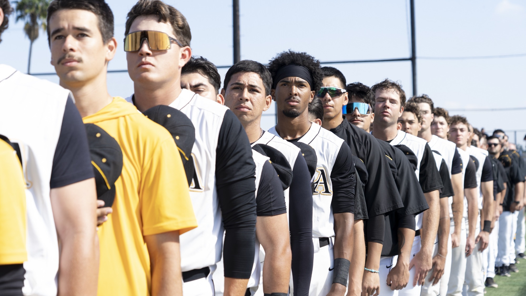 cal state la team lines up for playing of the national anthem