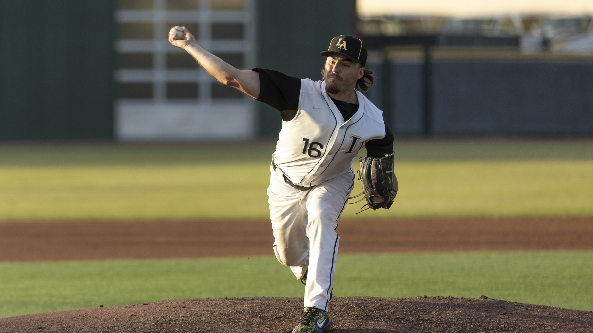 jake spence makes a pitch to the plate