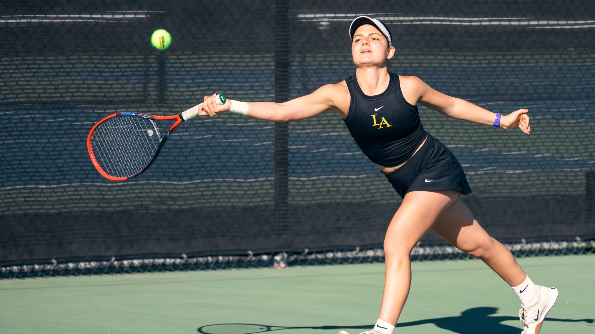 ainoho salo stretches to return a tennis shot