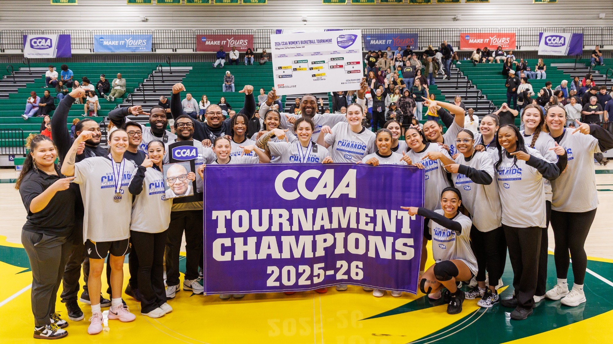 cal state la celebrates with CCAA Tournament banner