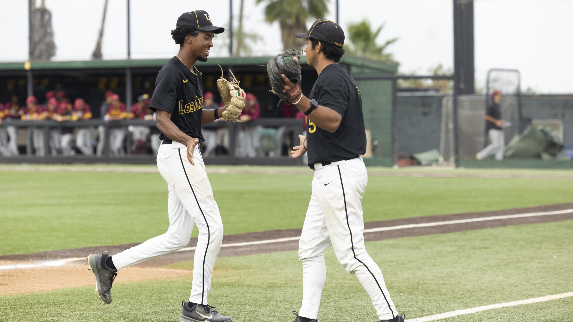 kadyn victorian and alberto prado celebrate at the end of an inning