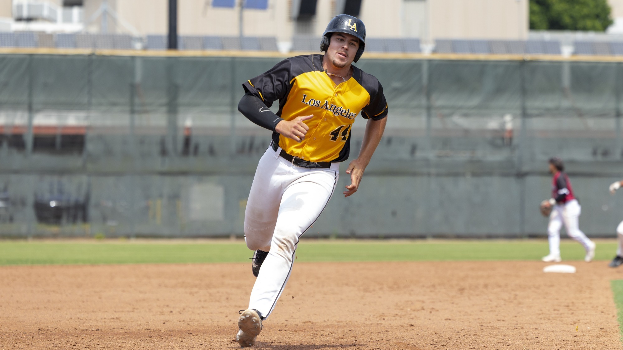 omar gonzalez rounds third base on his way to scoring a run