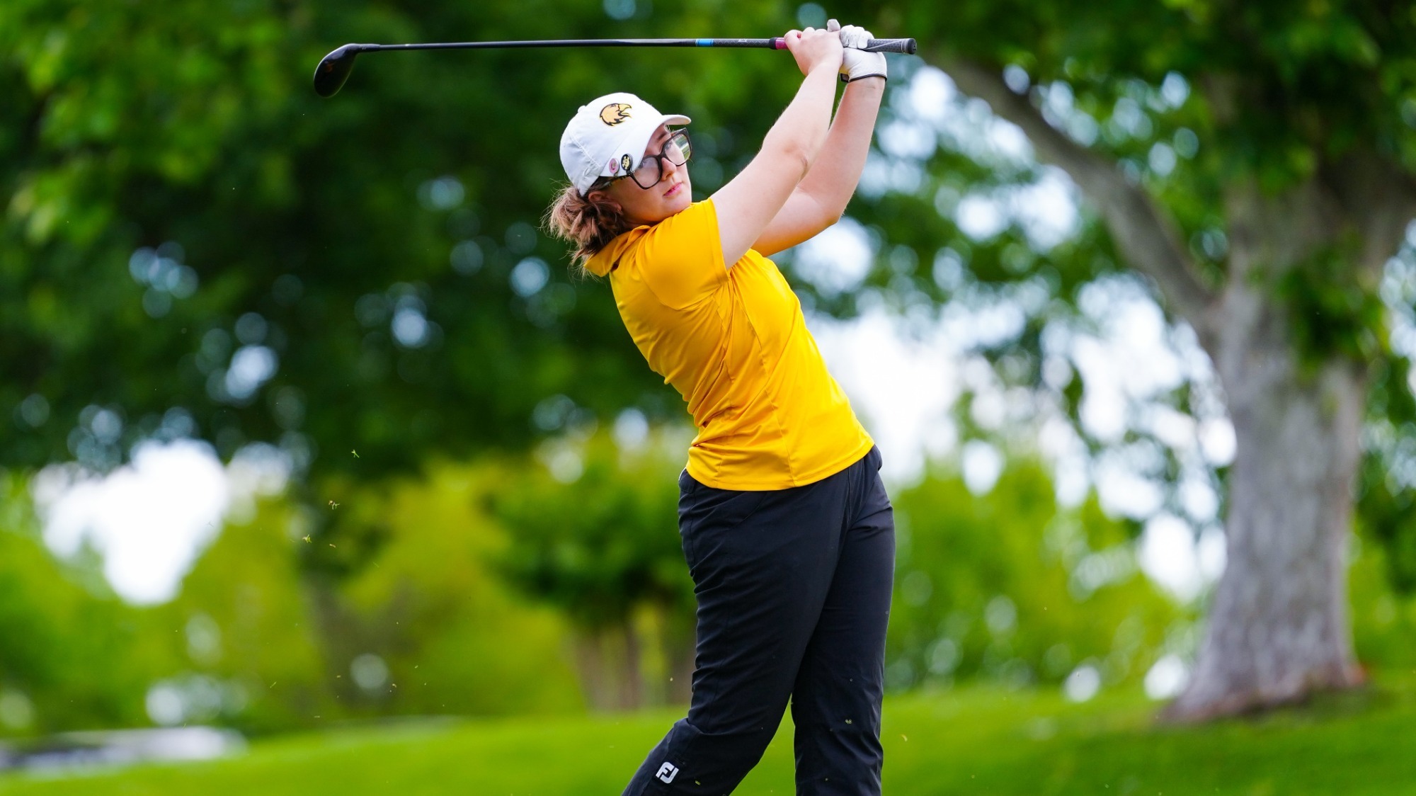 rilee crosby hits a drive at CCAA Championships