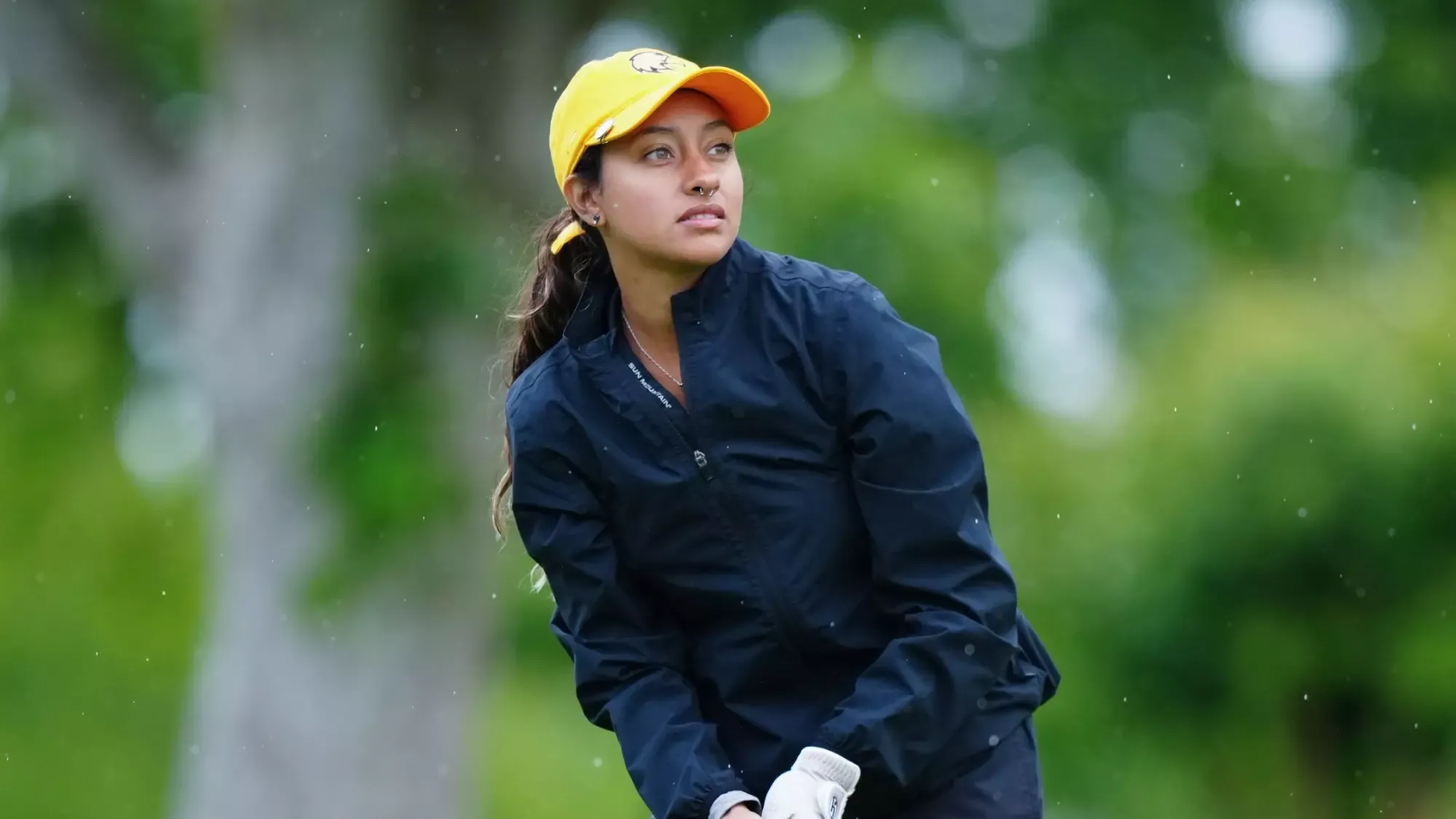 sarah amaya watches a drive on the final day of the CCAA Championships