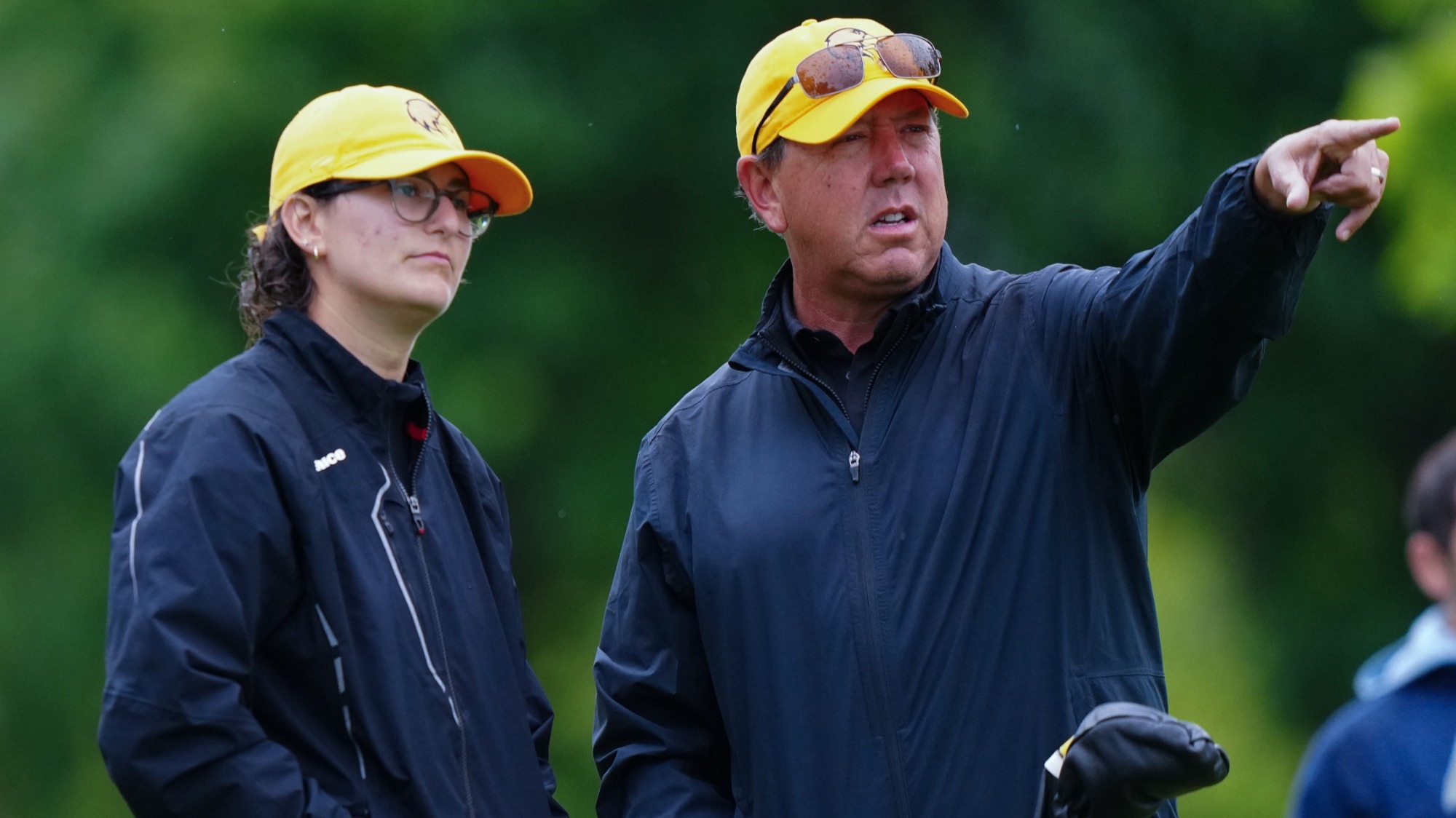 talia gutman and coach Hans Kersting strategize at the tee