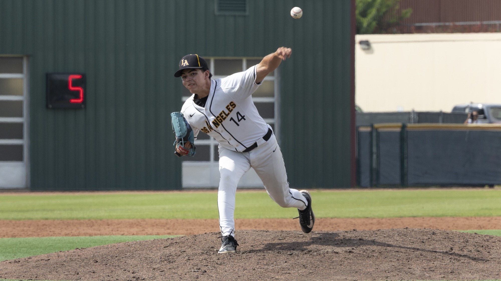 ismael quintero delivers a pitch to the plate