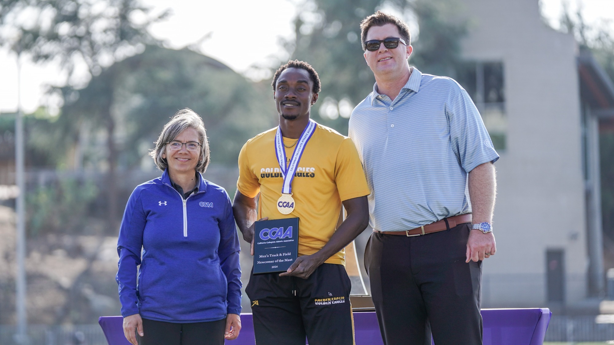 wallace aflamah is presented CCAA Newcomer of the Meet award