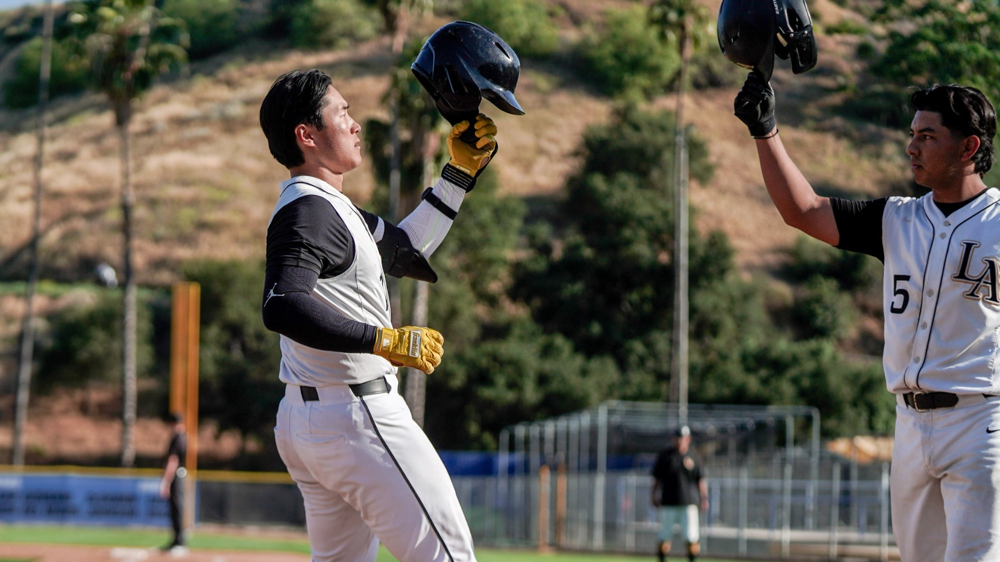 ben lee and alberto prado celebrate a home run in CCAA Tournament