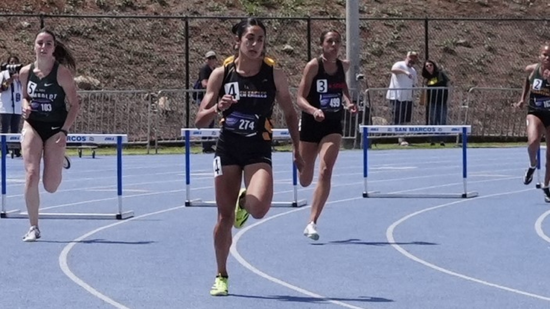 dalia romo leads the pack in hurdles race