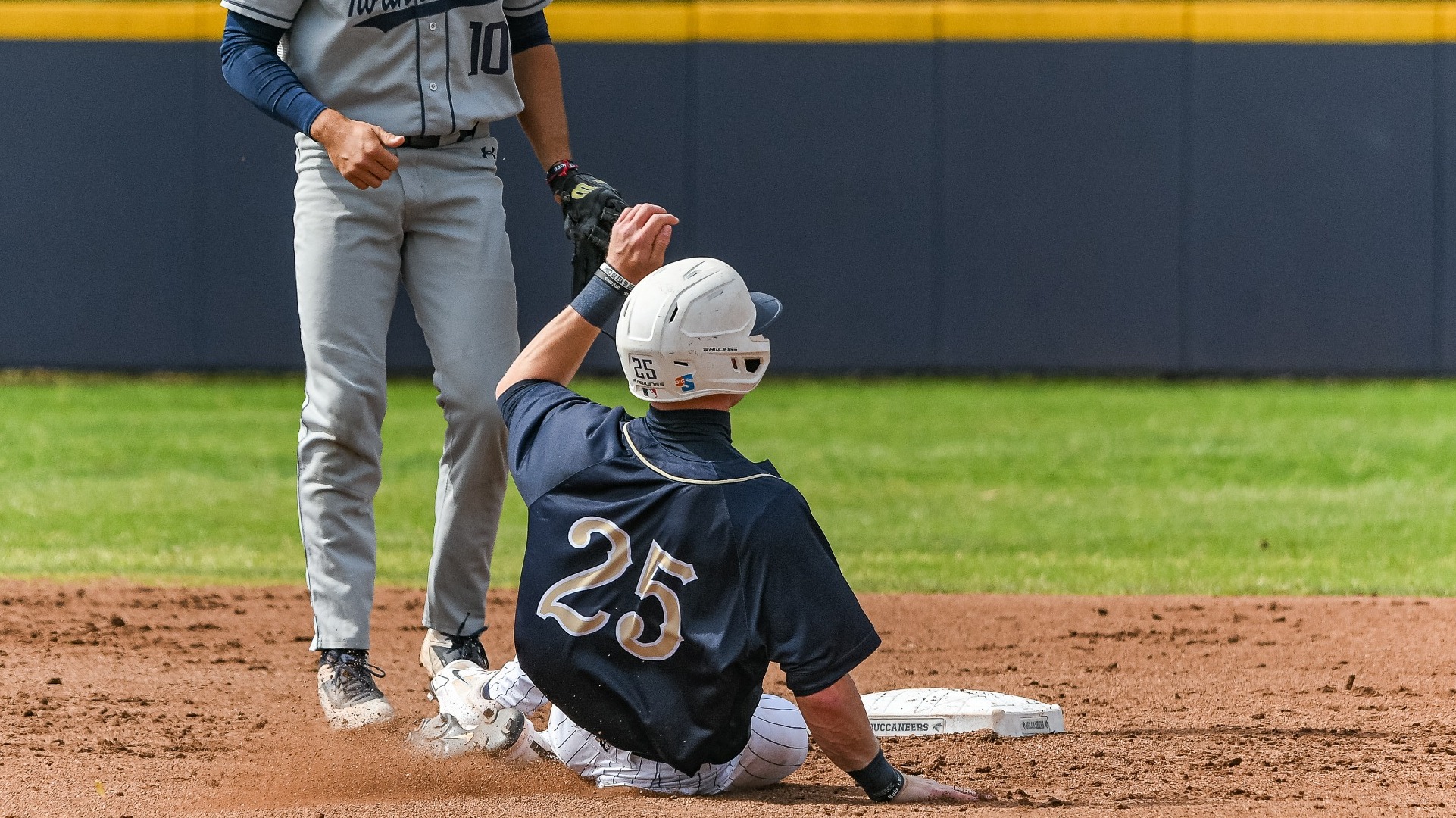Charleston, S.C. —  Charleston Southern outfielder Caden Wolfley (25) slides into to second base in Division 1 men’s baseball action between Charleston Southern University and University of North Florida on March 17, 2026, at Charleston Singleton Baseball Complex.(Mandatory Credit: Arthur Ellis Photography)