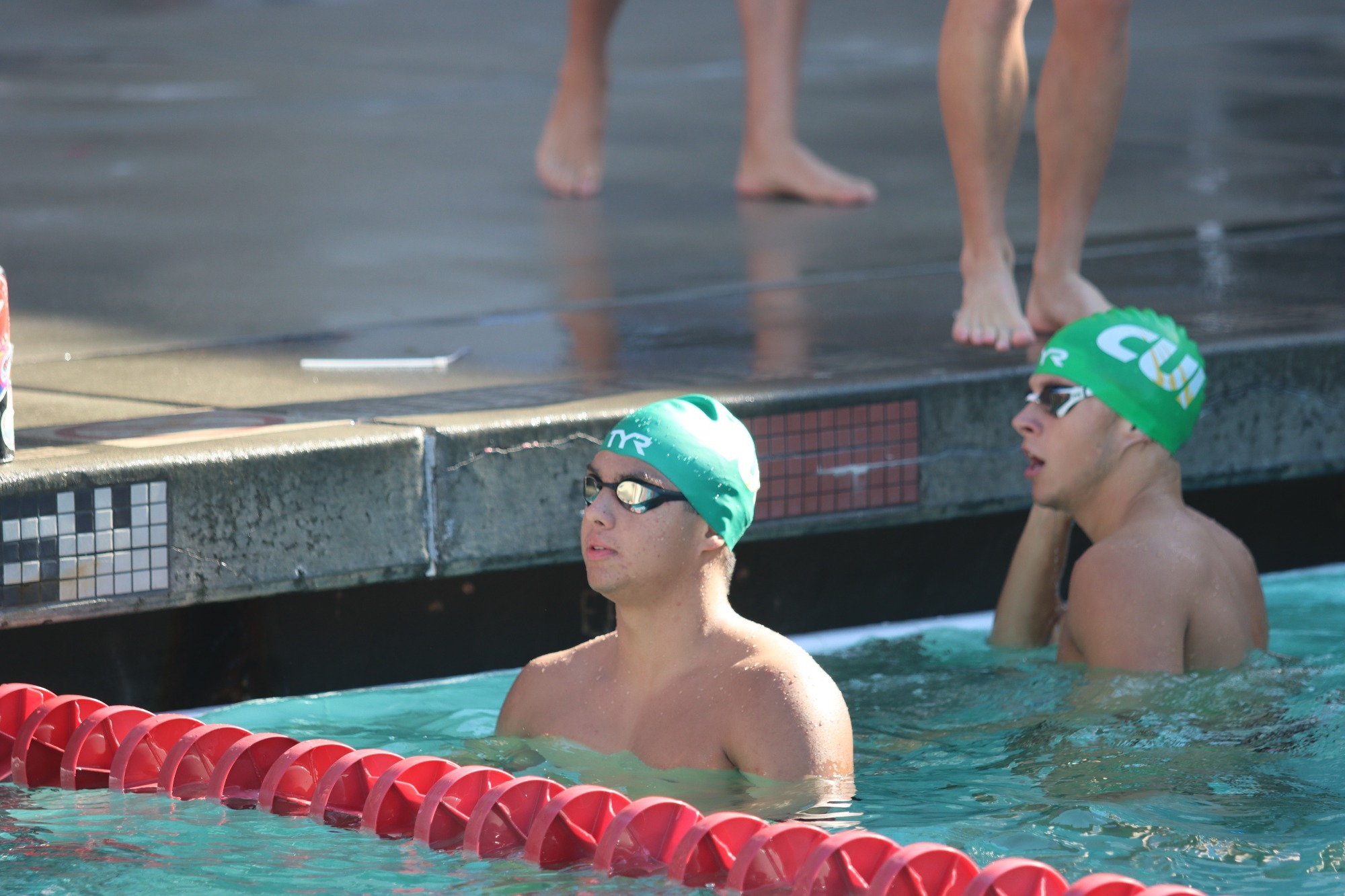 Jayden Hernandez in pool with new CUI green cap