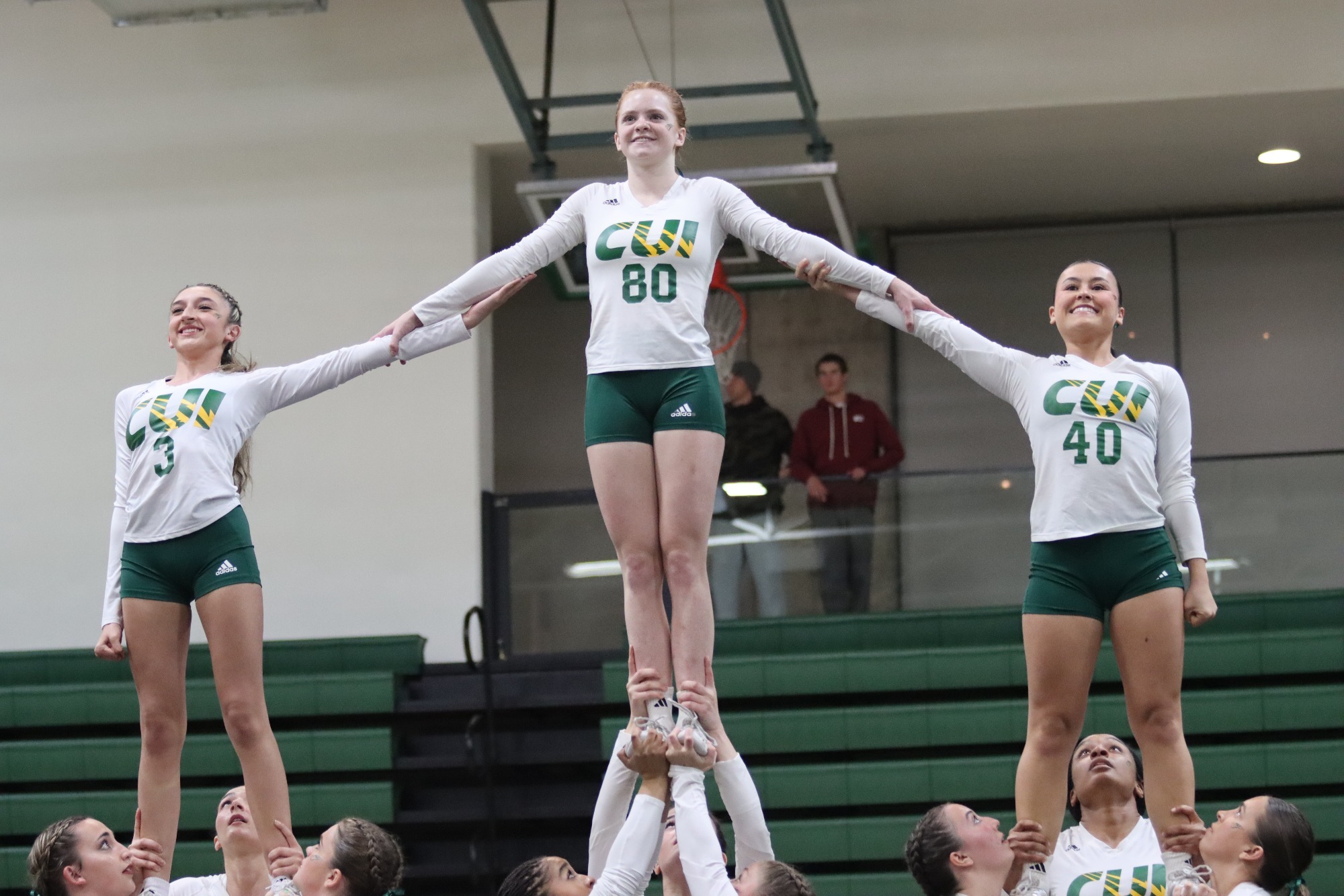 Stunt players holding their teammates