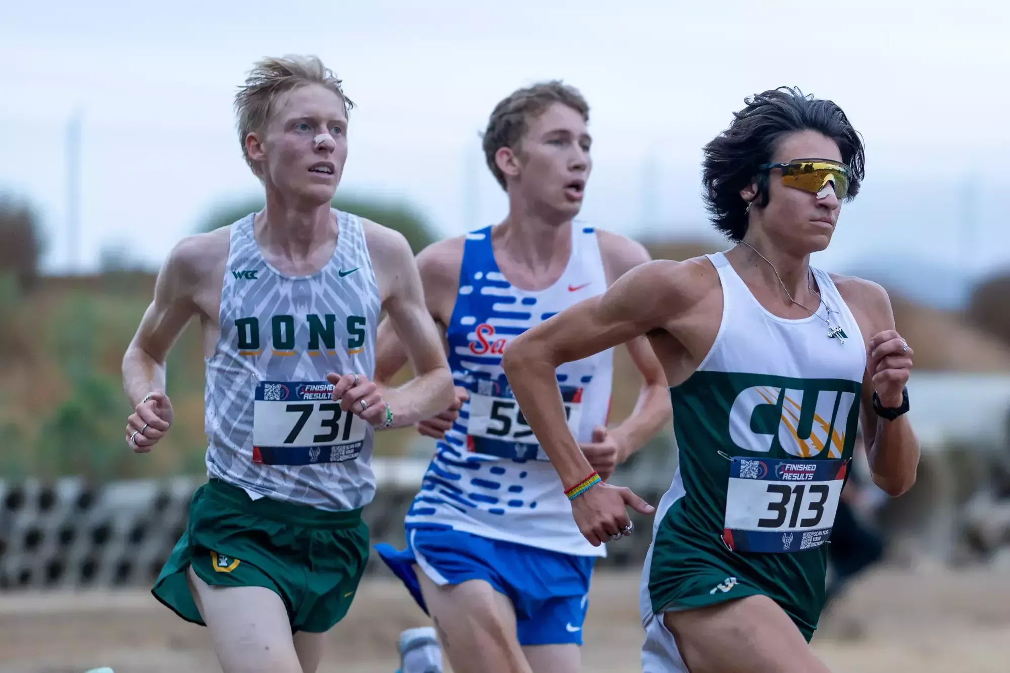 Noah Plaza racing school record in 8k at UCR Invite pic4 close up with 2 runners
