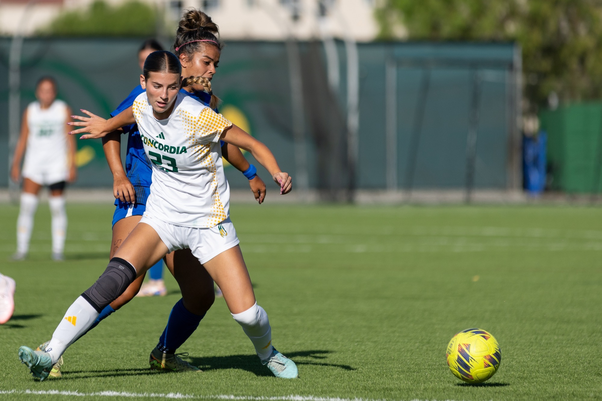 Mia Psarras fending off Chaminade player in 2026 match