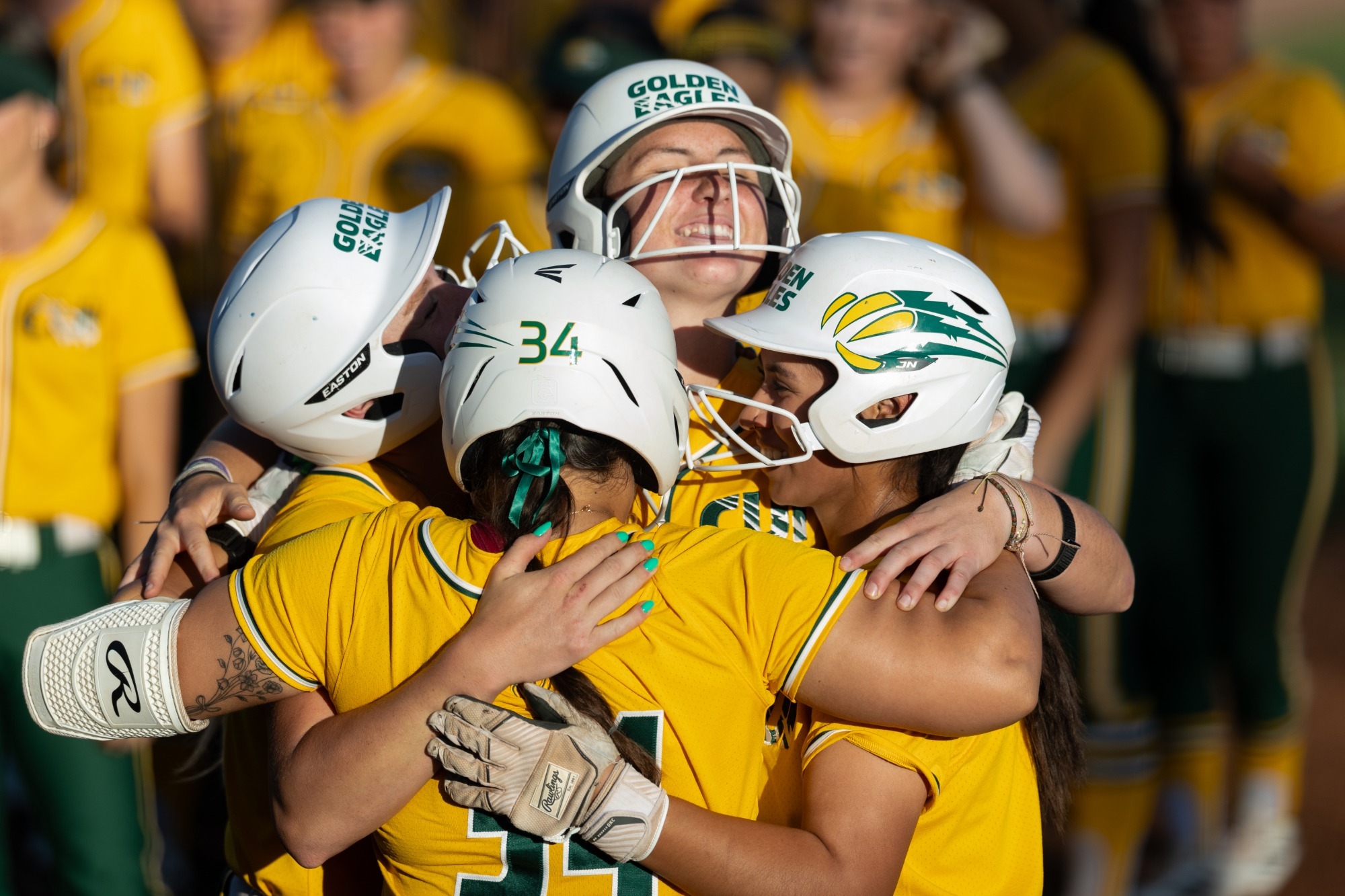 CUI Softball Hugging after Home Run