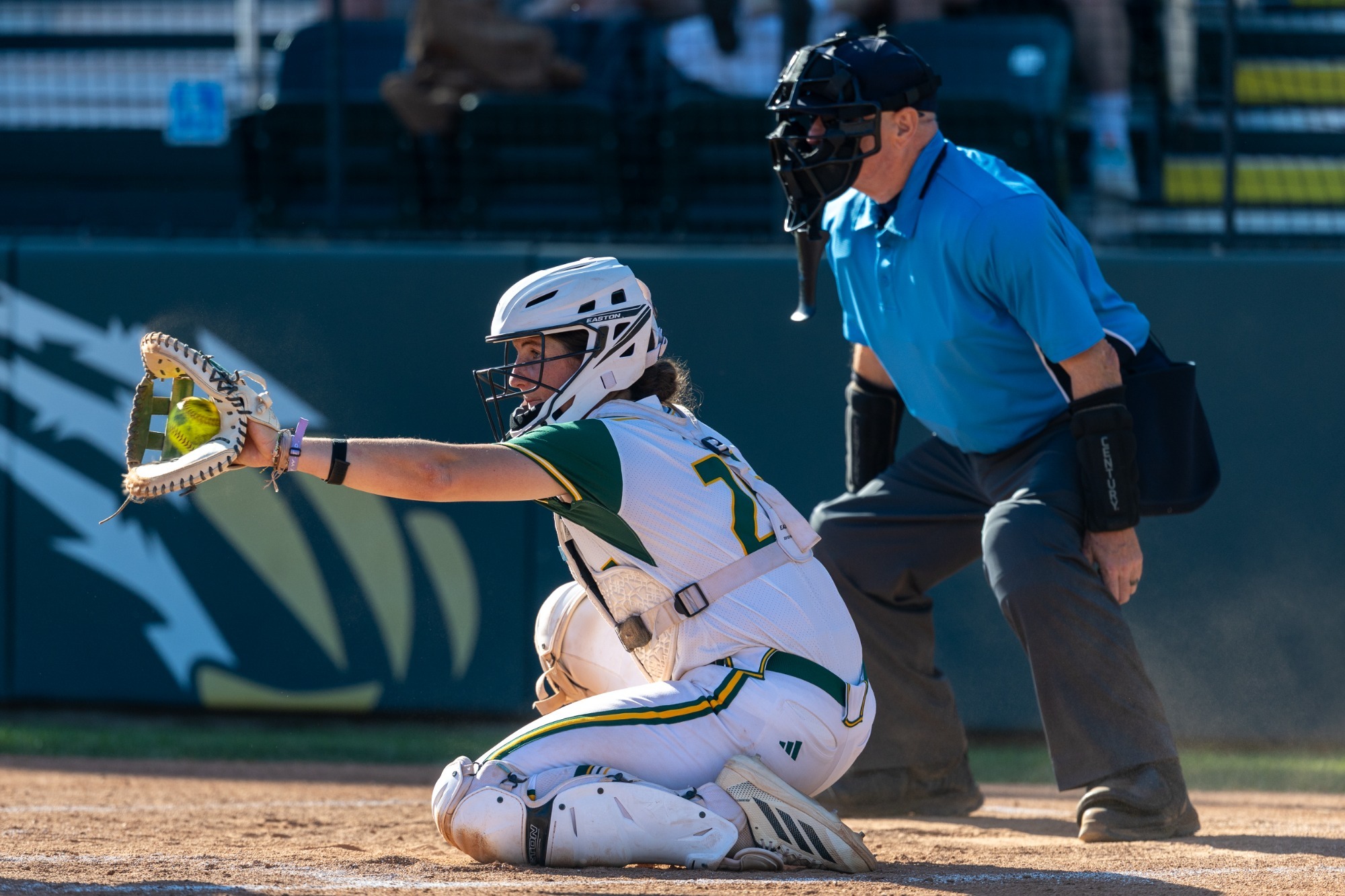 Morgan Kneubuhler catching softball junior year