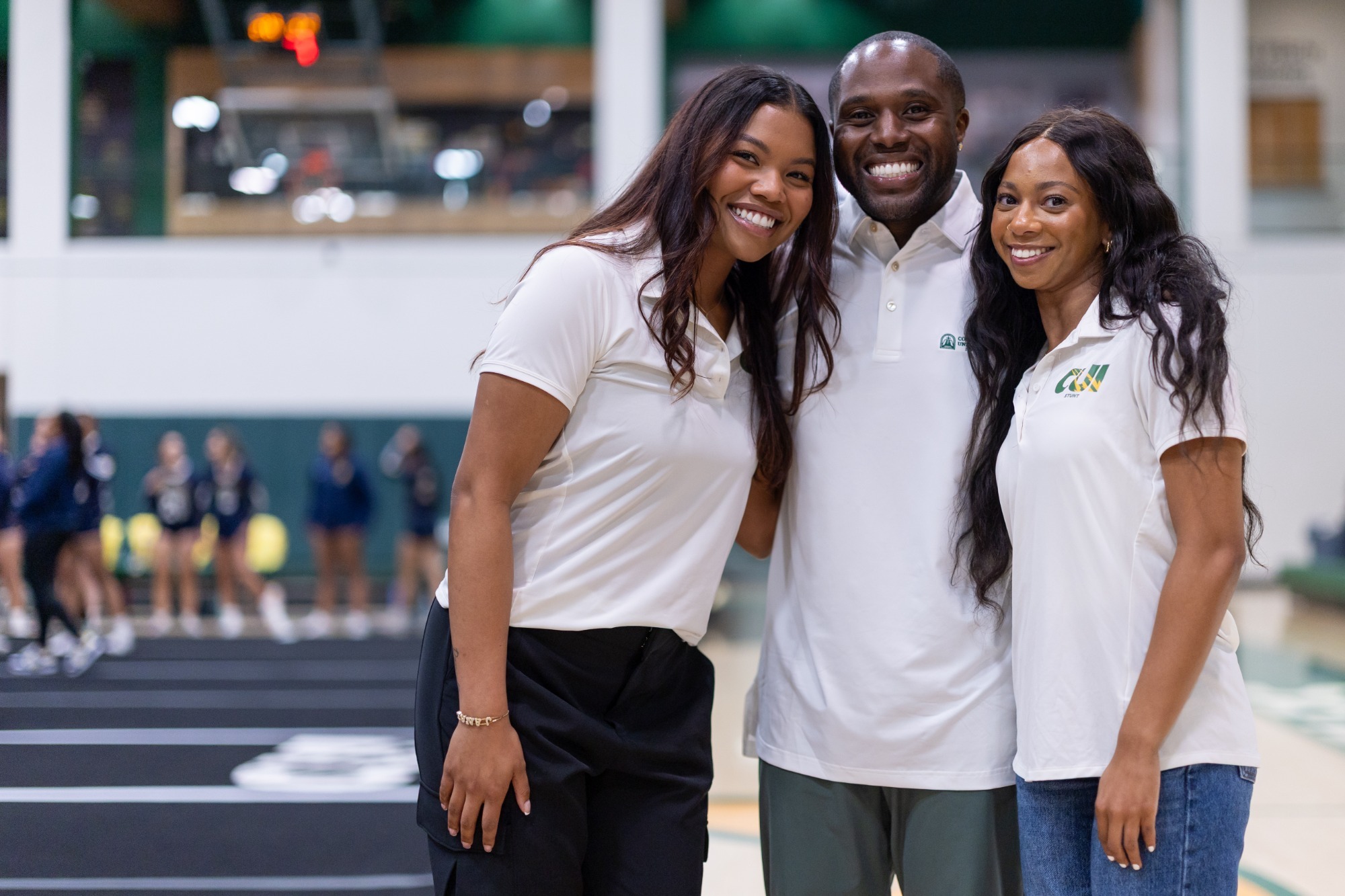 CUI Stunt coaches 2026 Janae Magpale with DJ and Christian Greene