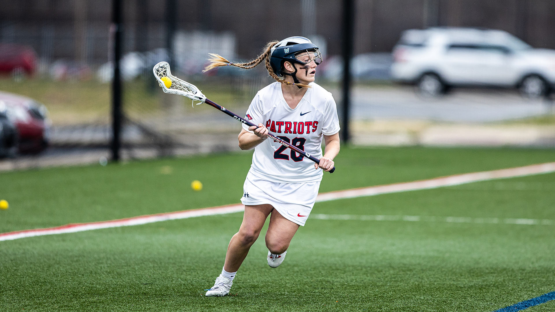 Ashlee Baker working from behind cage