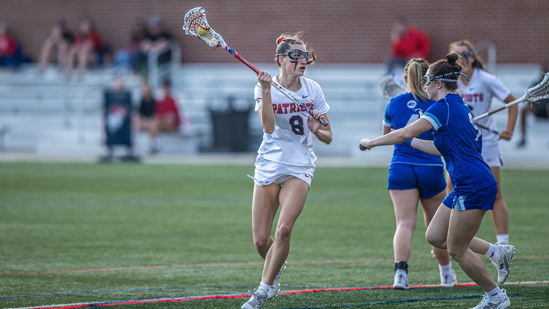 Anna Lobbezzo holding the ball and directing the offense