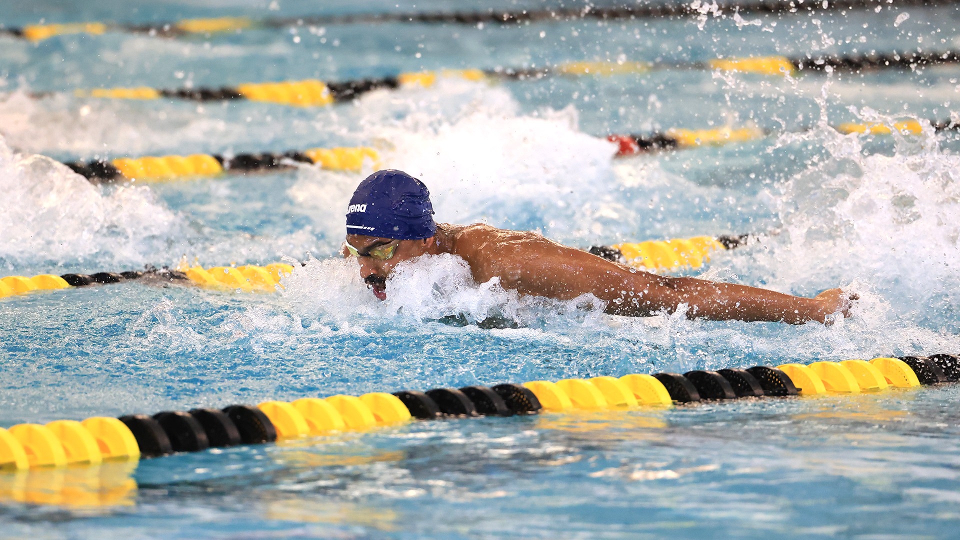 Ruthiik Satti doing the 100 fly at the MSC Championships