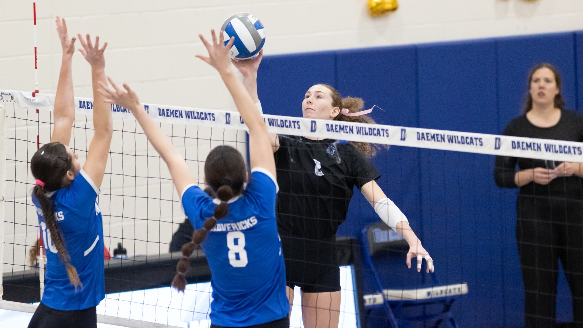 Molly Ryan tips the ball against net pressure in a recent volleyball match for Daemen