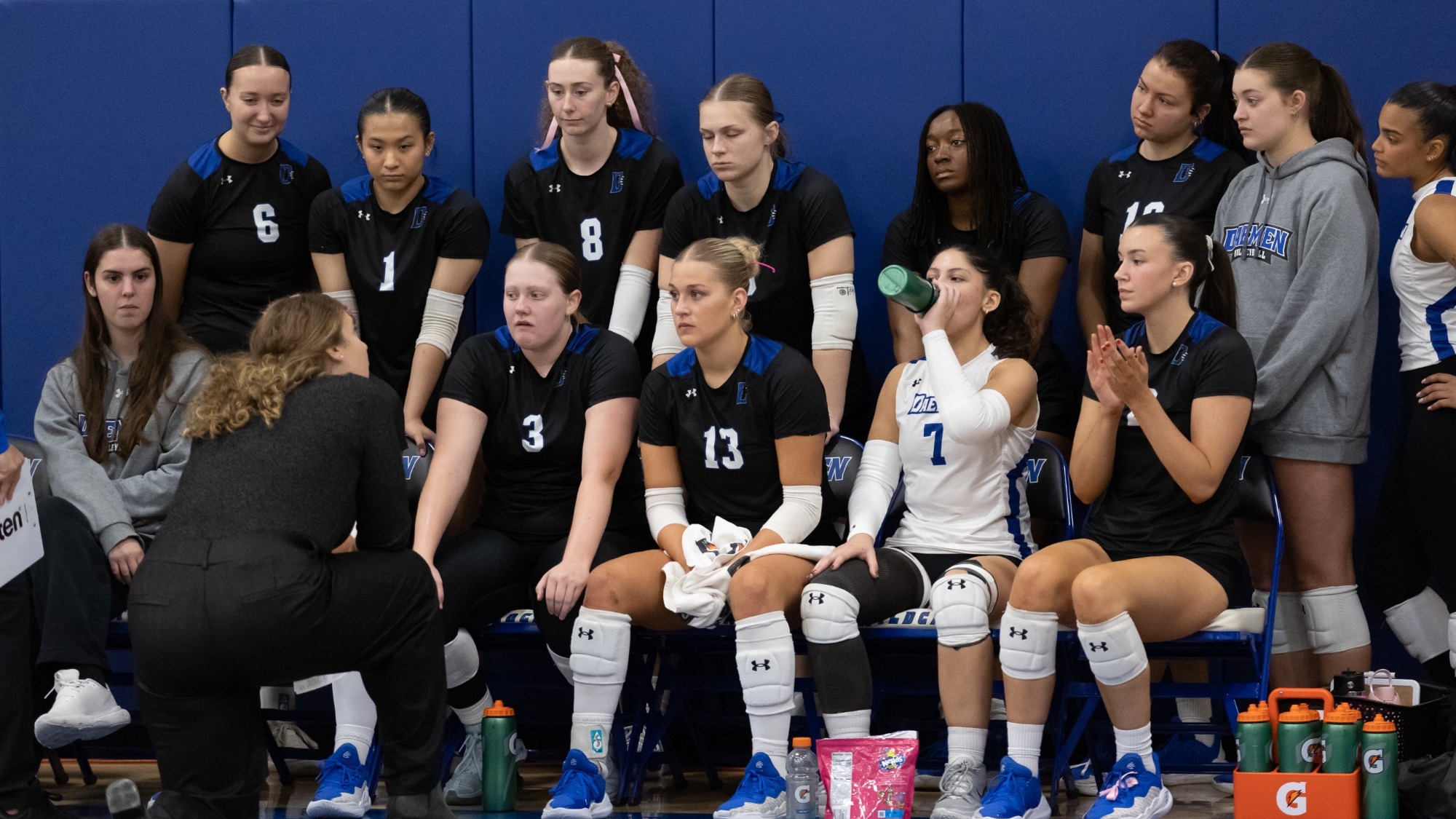 The Daemen women's volleyball team gets instruction from head coach Kaysie Shebeneck during a timeout