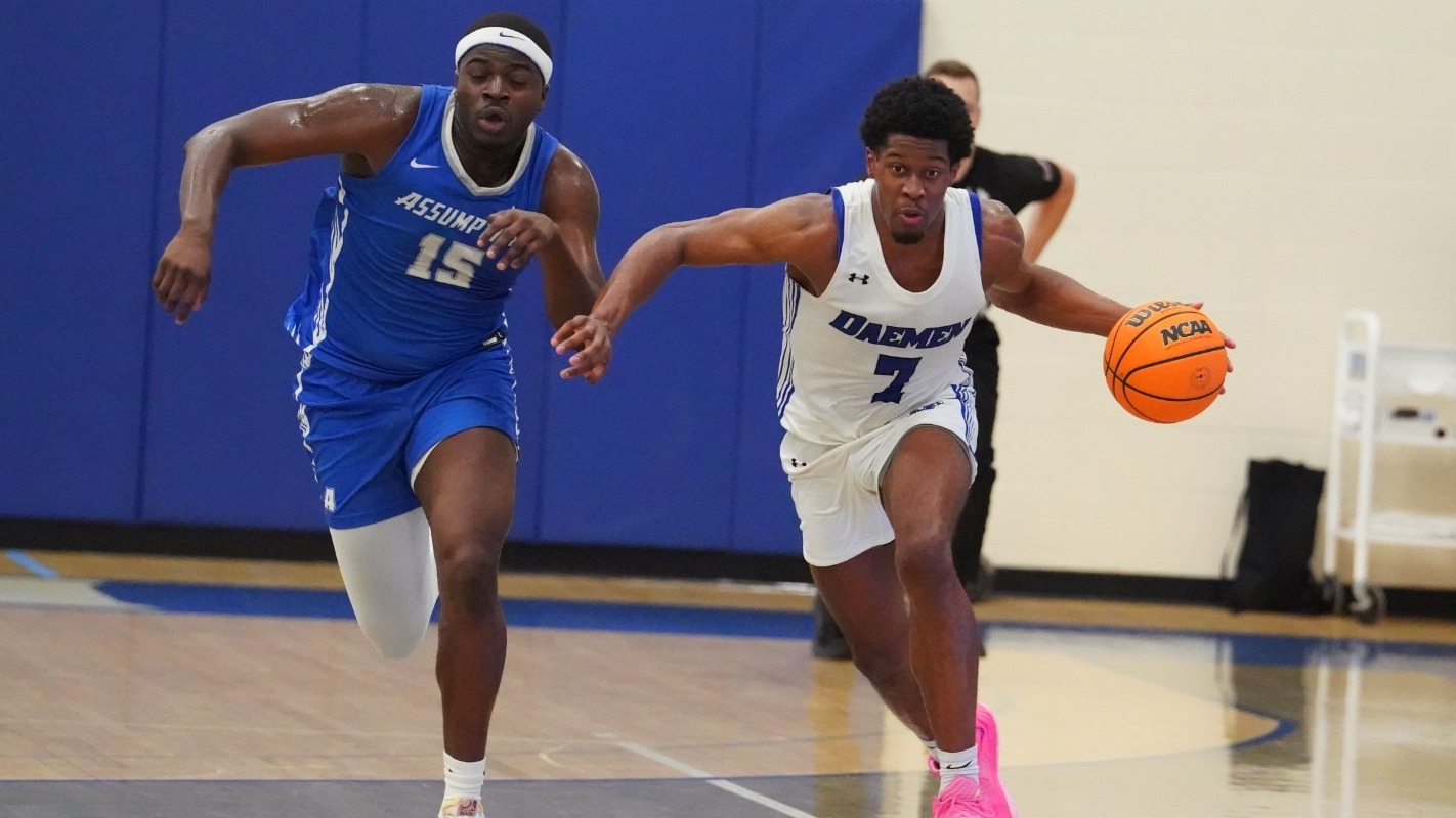 Phil Nwugwo dribbles past an Assumption defender