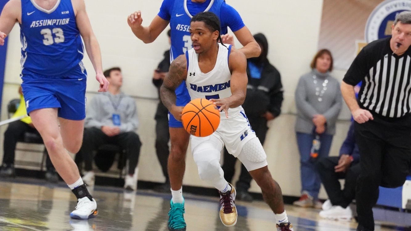 Justin Glover dribbles up the court