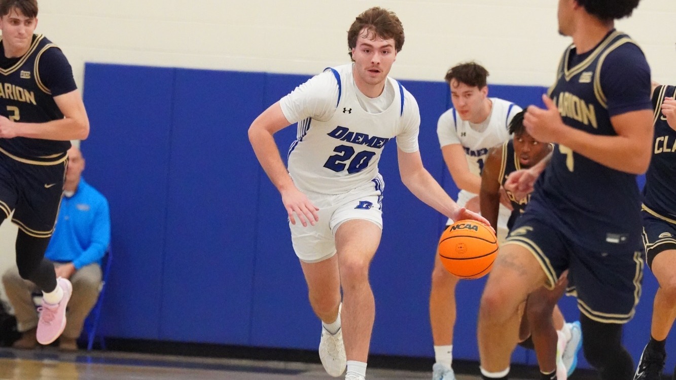 Zach Philipkoski dribbles up the court 
