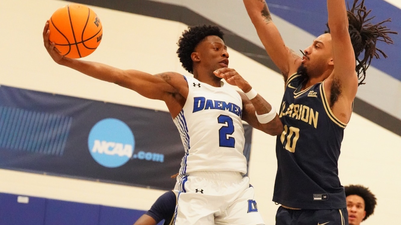 Ryan Heath jumps and tries to avoid a defender with his pass