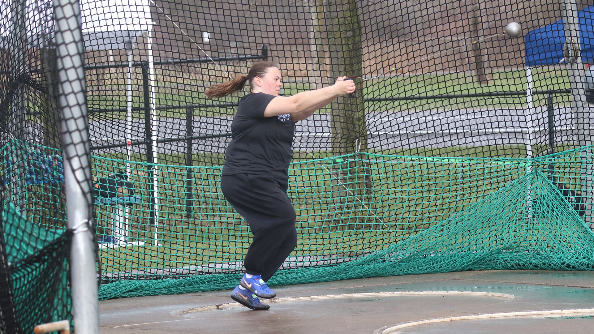 Kristen Oliver throws in the hammer throw