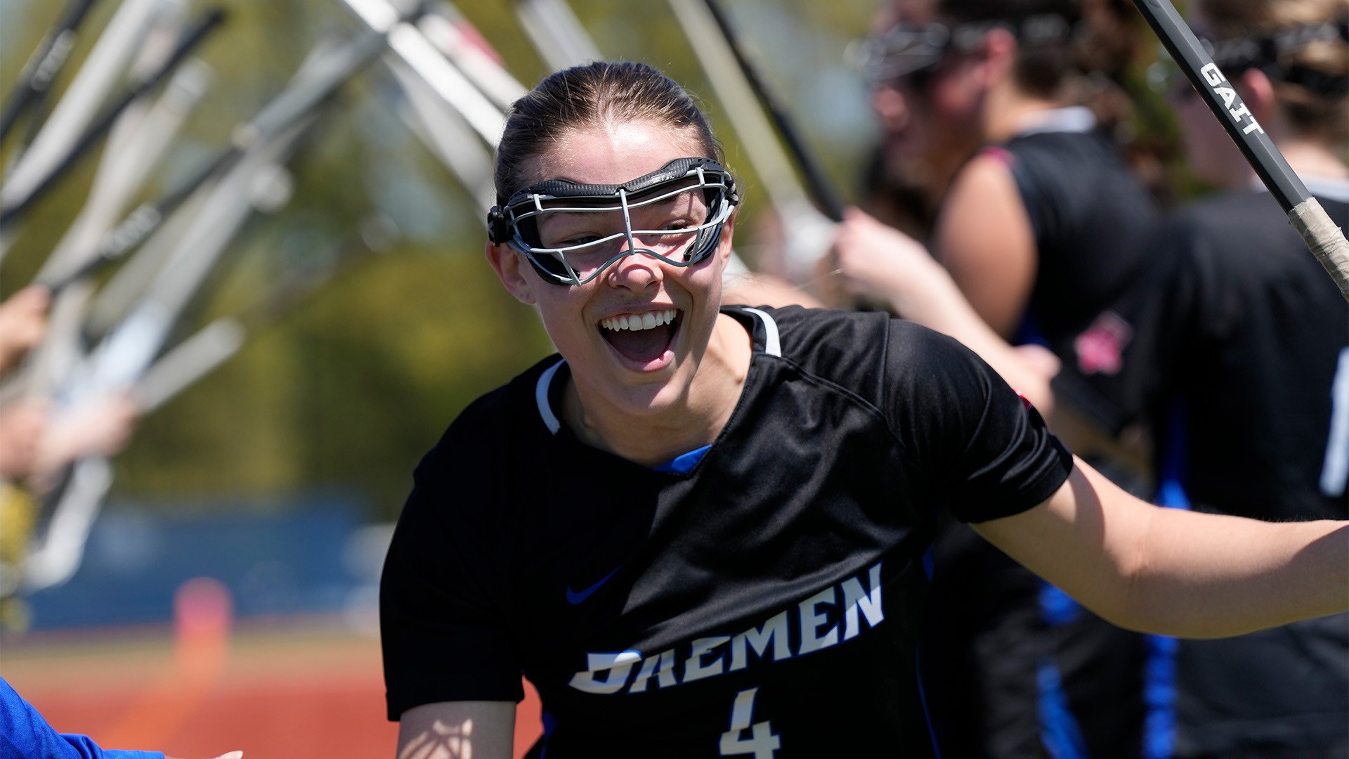 Senior Midfielder Cameron Briggs smiles during lineups against Mercy