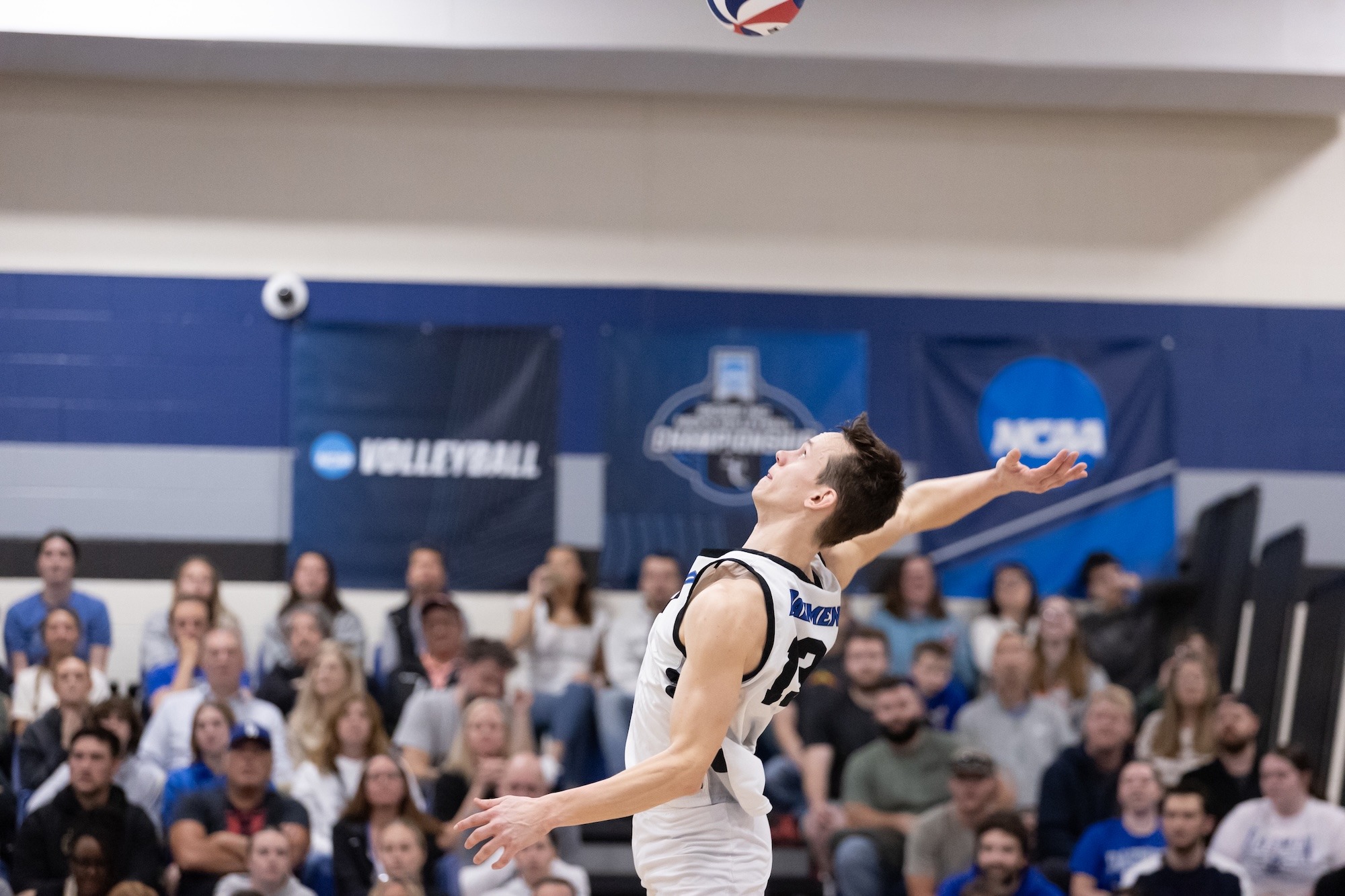 Zach Schneider serves against Penn State