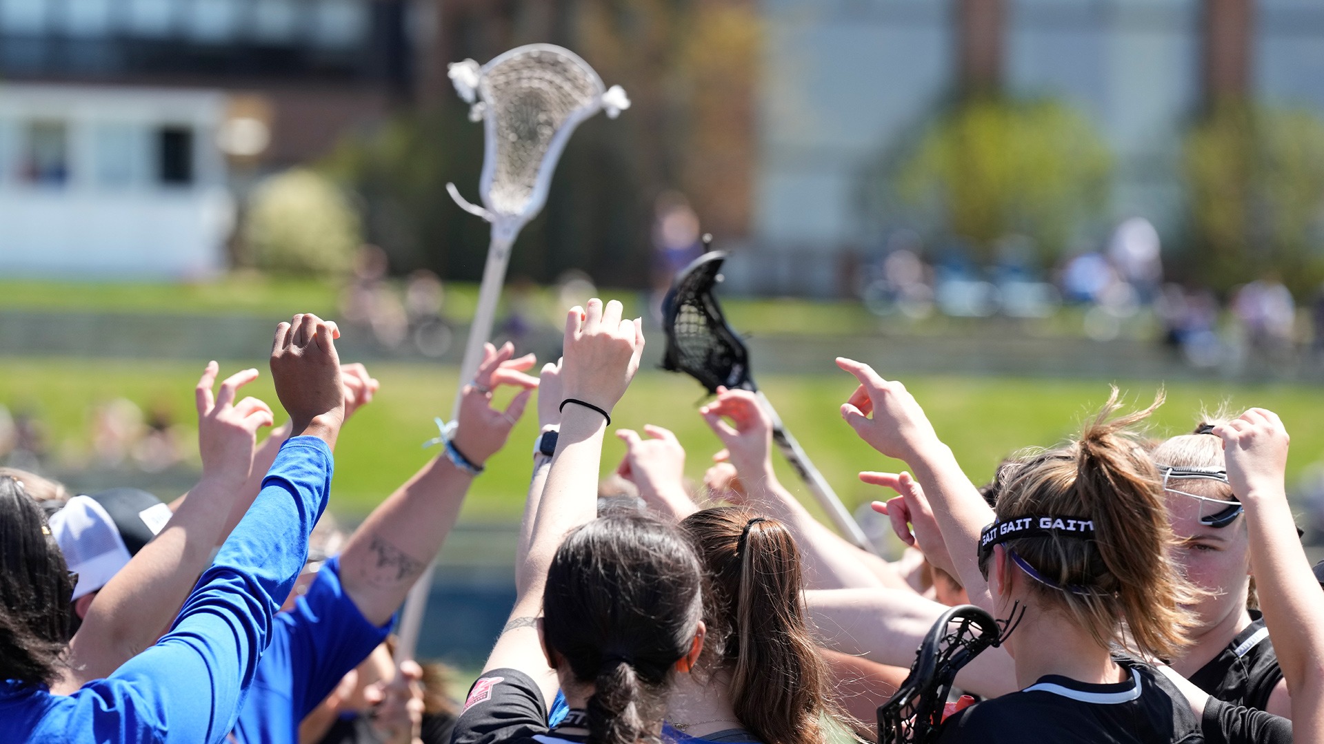 Women's lacrosse huddle against Mercy