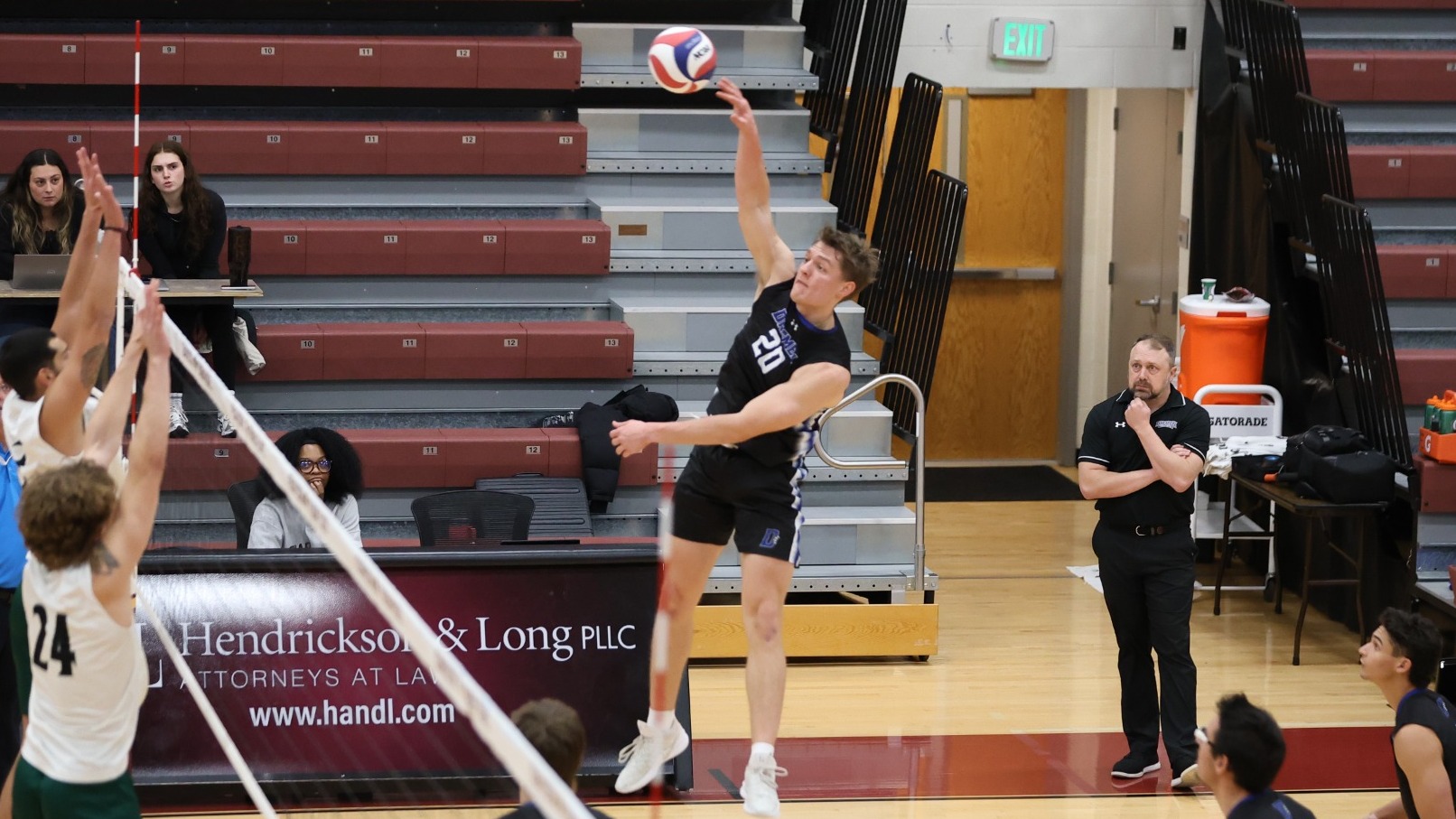 Aidan White spikes the ball 