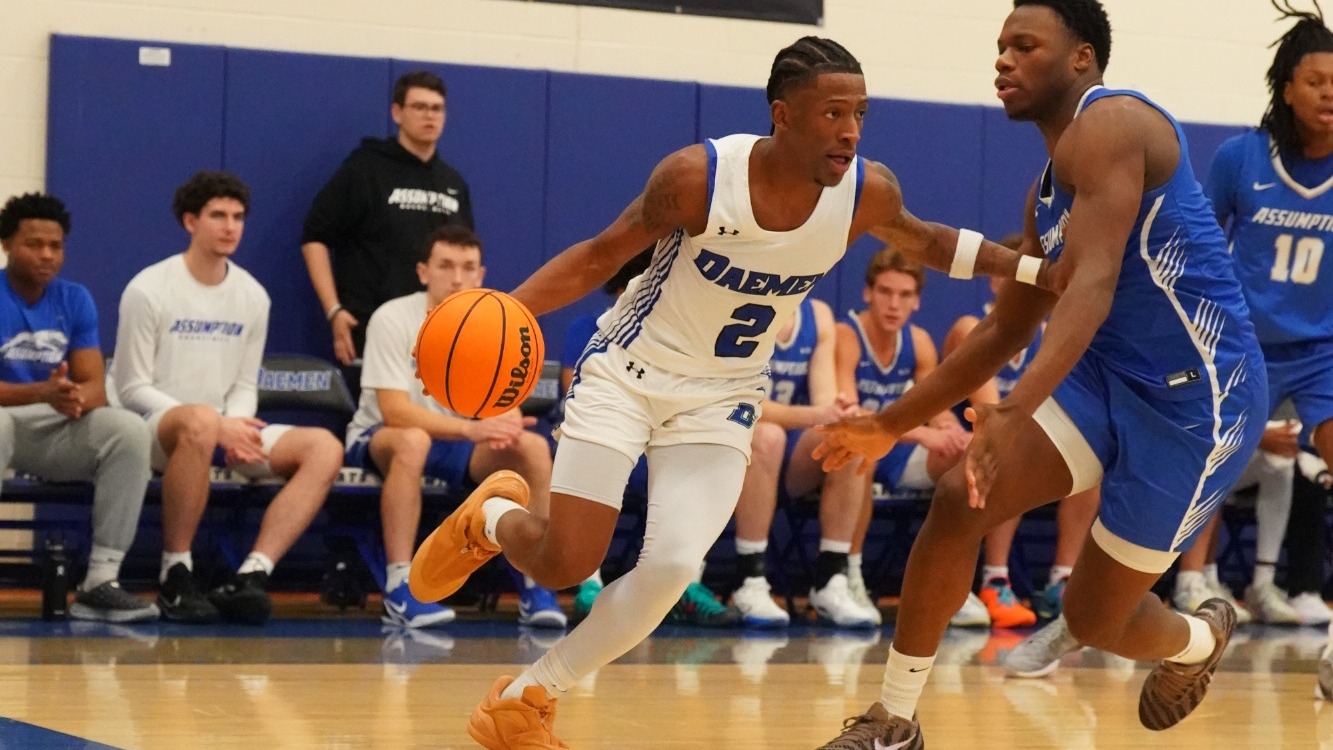 Ryan Heath dribbles along the baseline past a defender