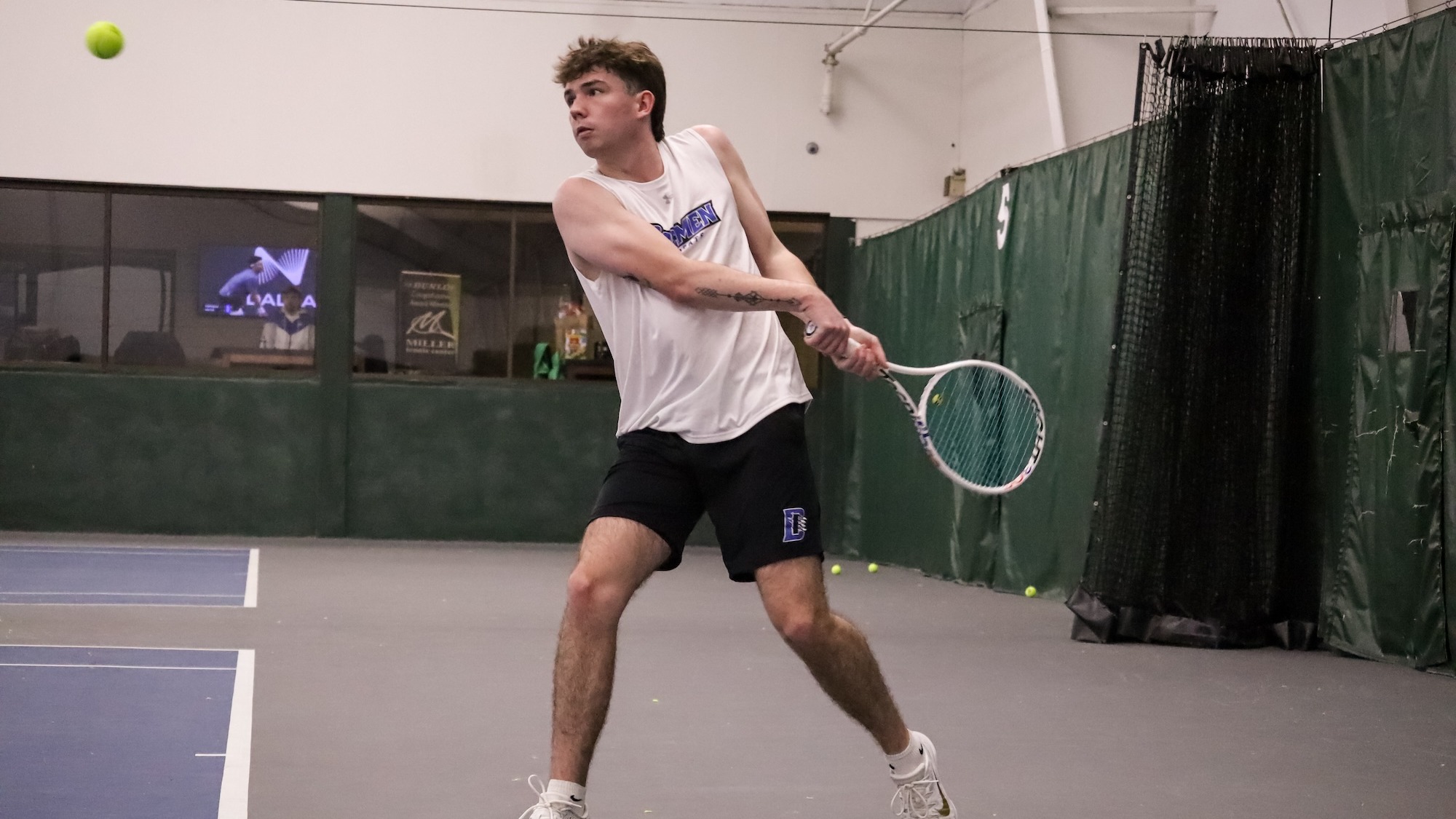 Riley Fitzgerald swings at a ball against West Liberty